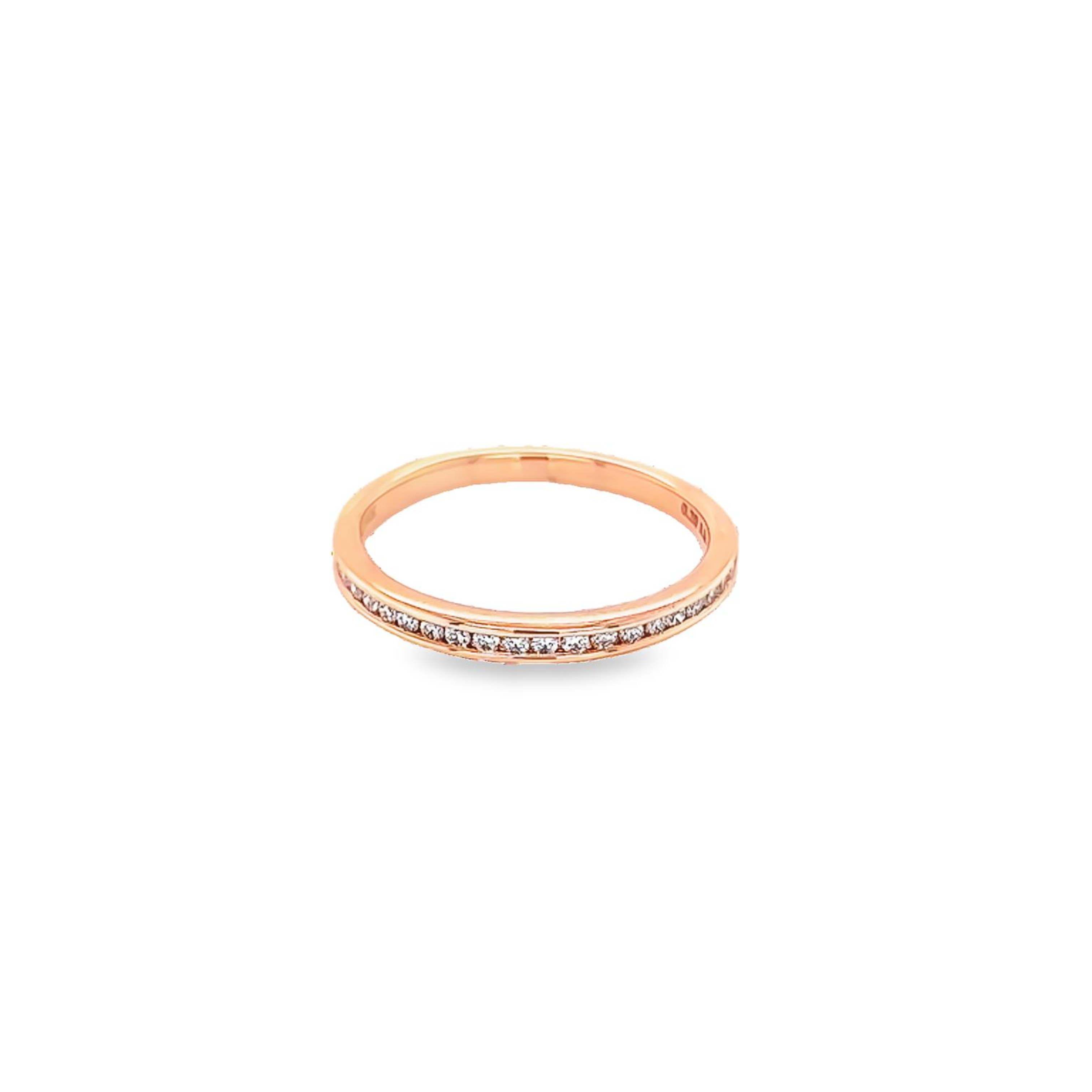 14 Karat rose gold channel set wedding band Size 6.5 with 24=0.20 total weight round brilliant G VS Diamonds