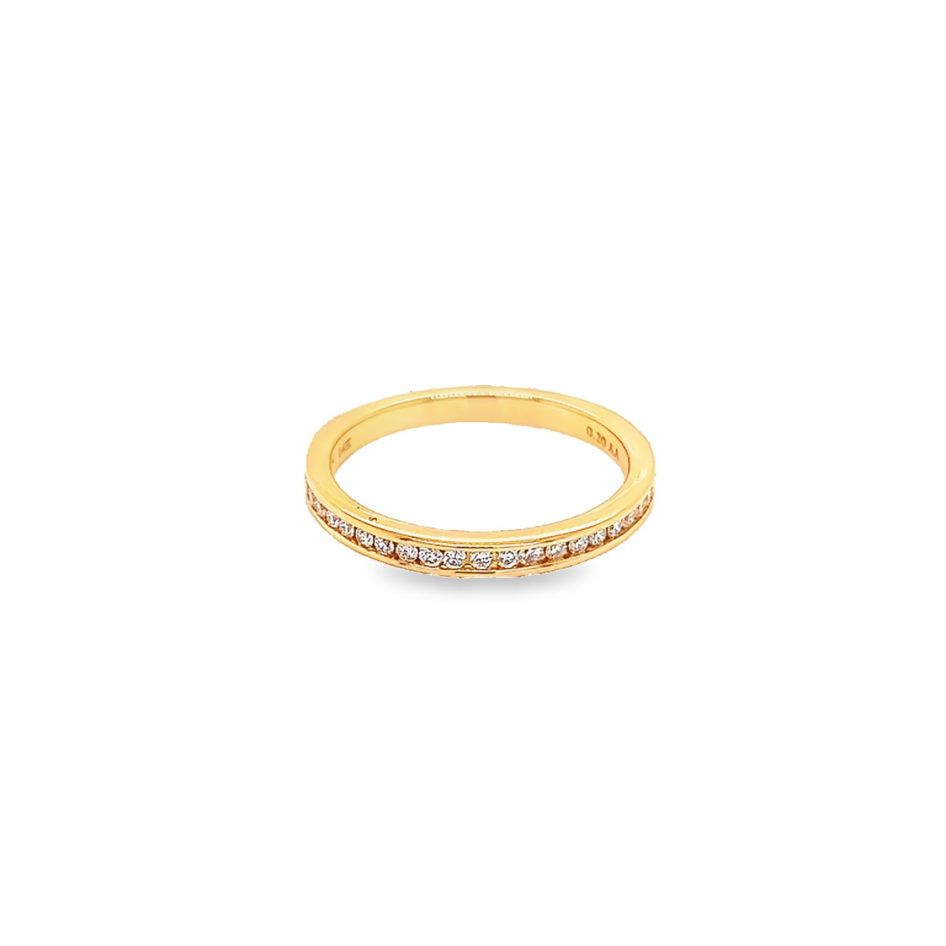14 Karat yellow gold channel set wedding band Size 6.5 with 24=0.20 total weight round brilliant G VS Diamonds