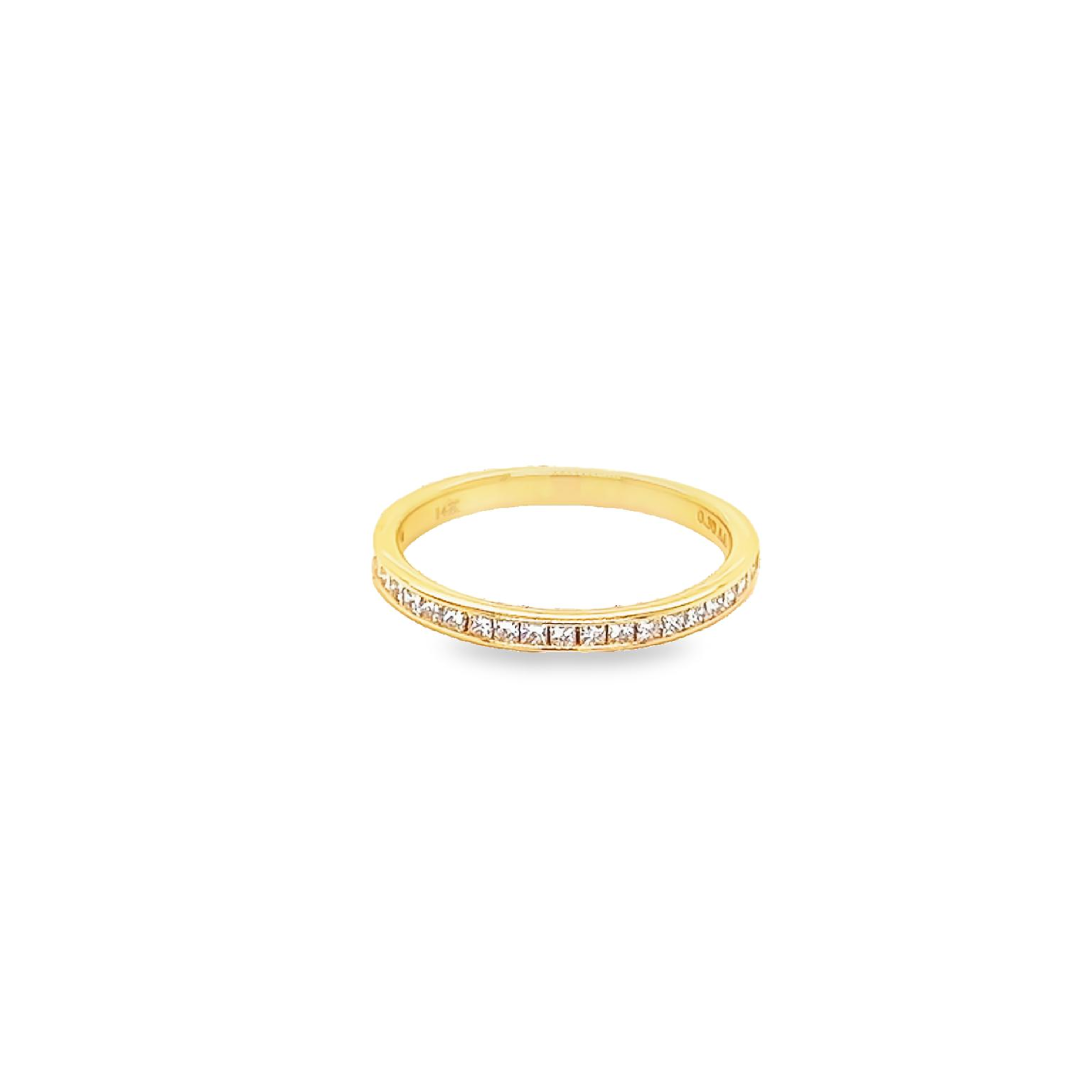 14 Karat yellow gold channel set wedding band Size 6.5 with 23=0.30 total weight princess G VS Diamonds