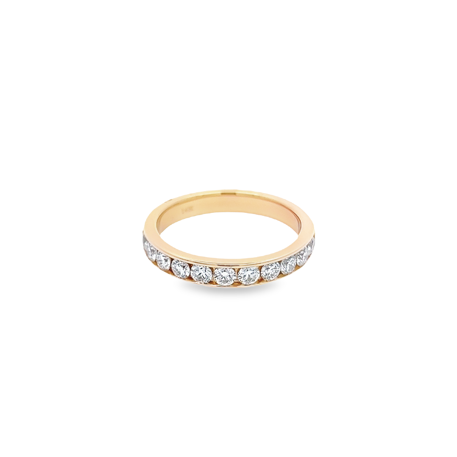 14 Karat yellow gold channel set wedding band Size 6.5 with 12=0.75 total weight round brilliant G VS Diamonds