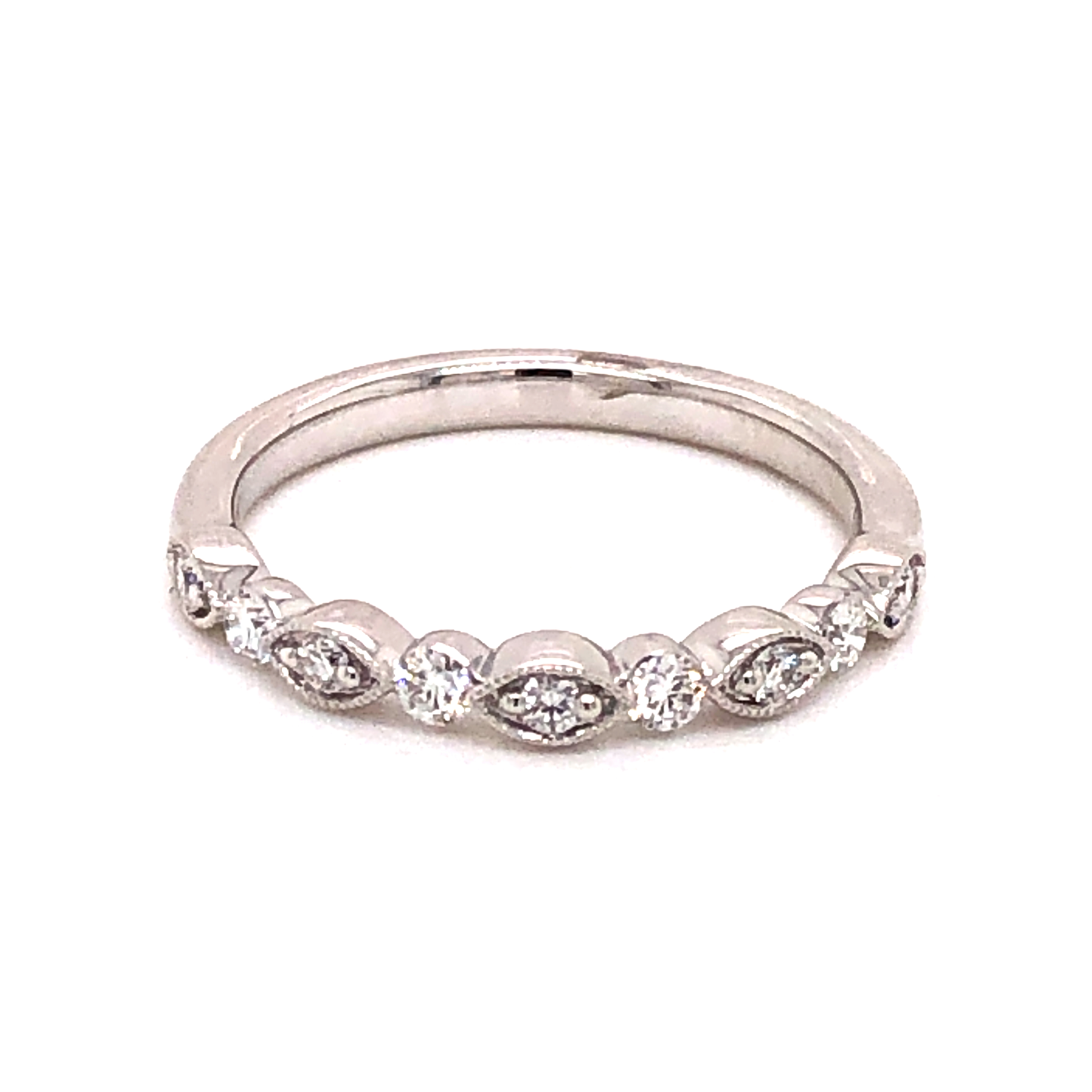 14 karat white gold band with 9=0.25 total weight round brilliant G VS Diamonds. Size 6.5