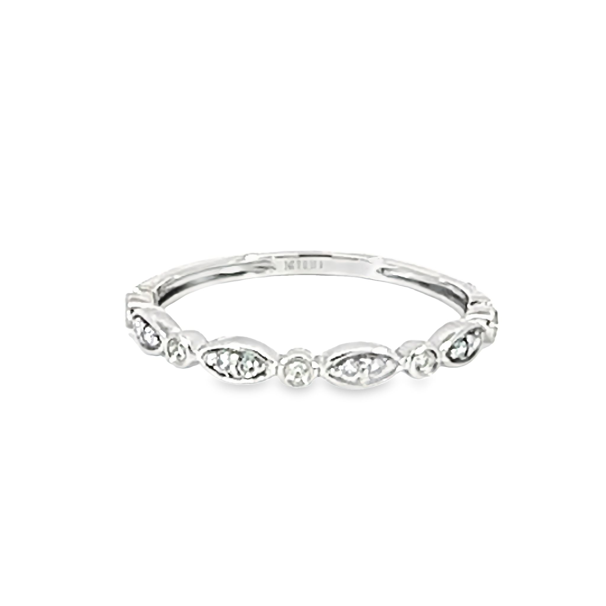 14 karat white gold with 13=0.10 carat total weight G VS Diamond stackable band. Size 6.5