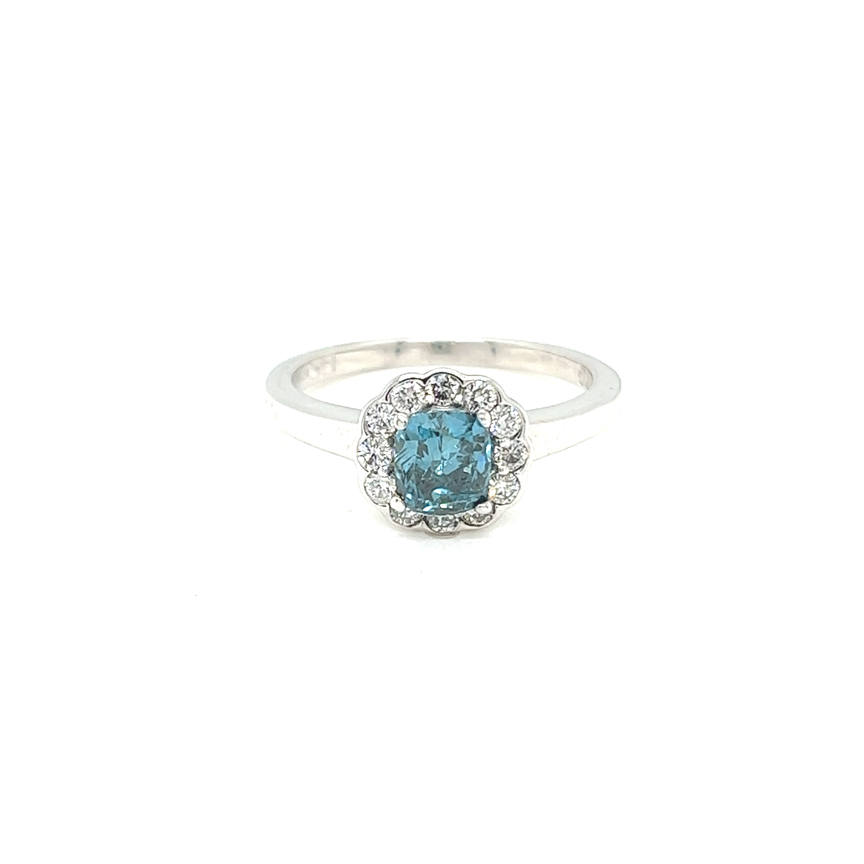 14 Karat white gold ring with one cushion cut blue irradiated Diamond that weighs .70carats and 12 round brilliant Diamonds with G color and SI clarity.  REF#130-805
