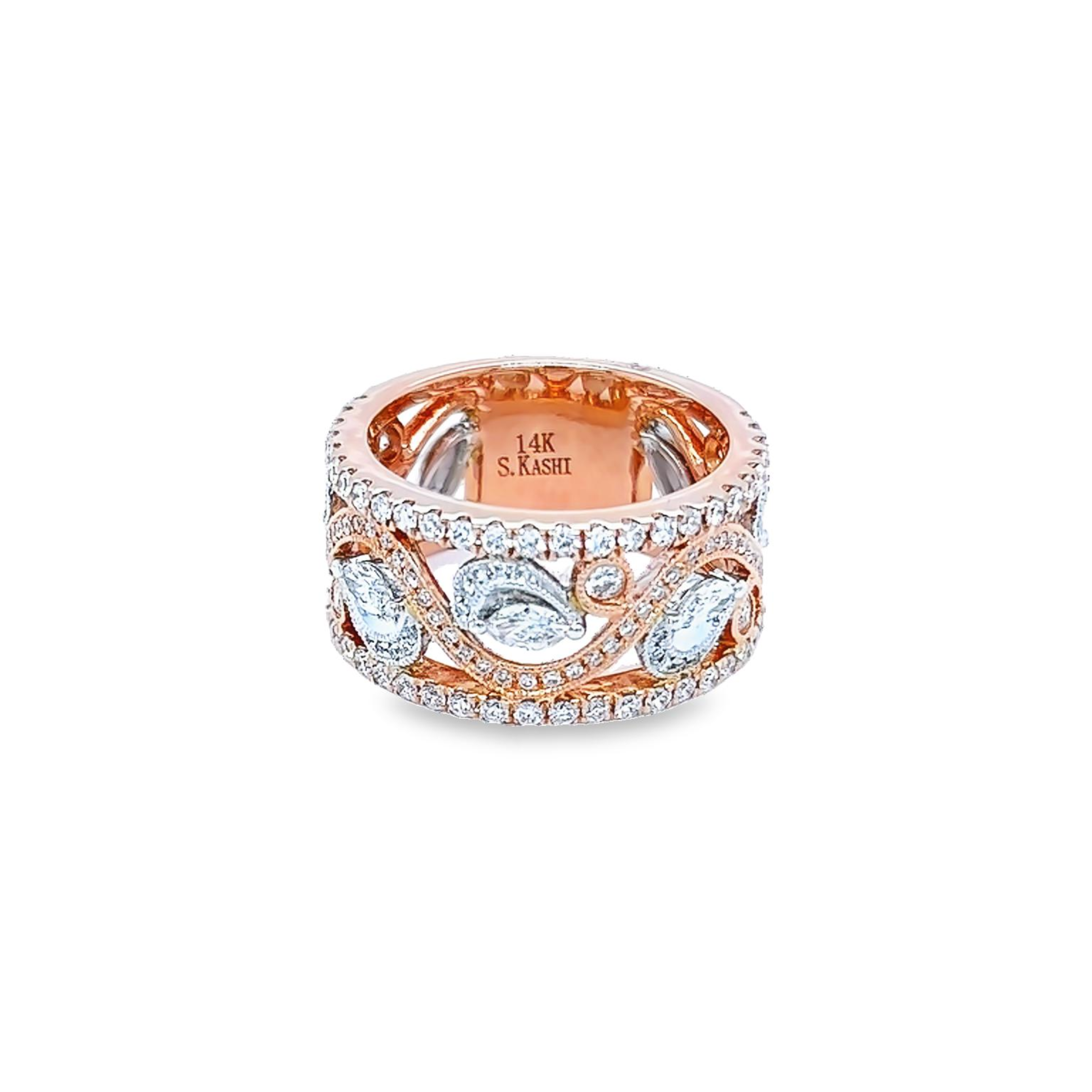 14 Karat rose and white gold ring size 6.5 with 5=0.38  total weight Marquise G VS Diamonds and 129=0.88 total weight round brilliant G VS Diamonds
