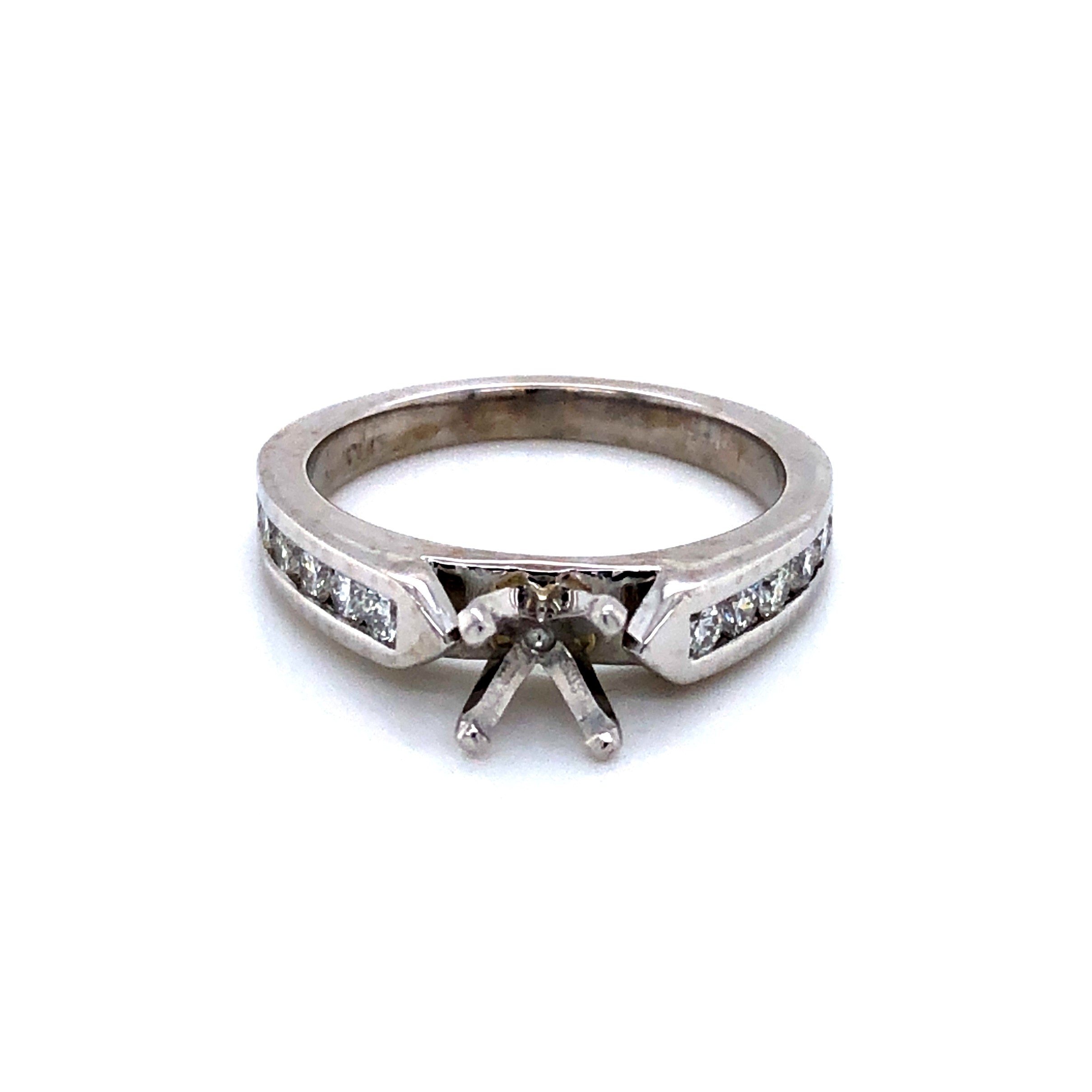 Platinum semi mount engagement ring  with 12=0.40TW Round Brilliant G VS Diamonds.