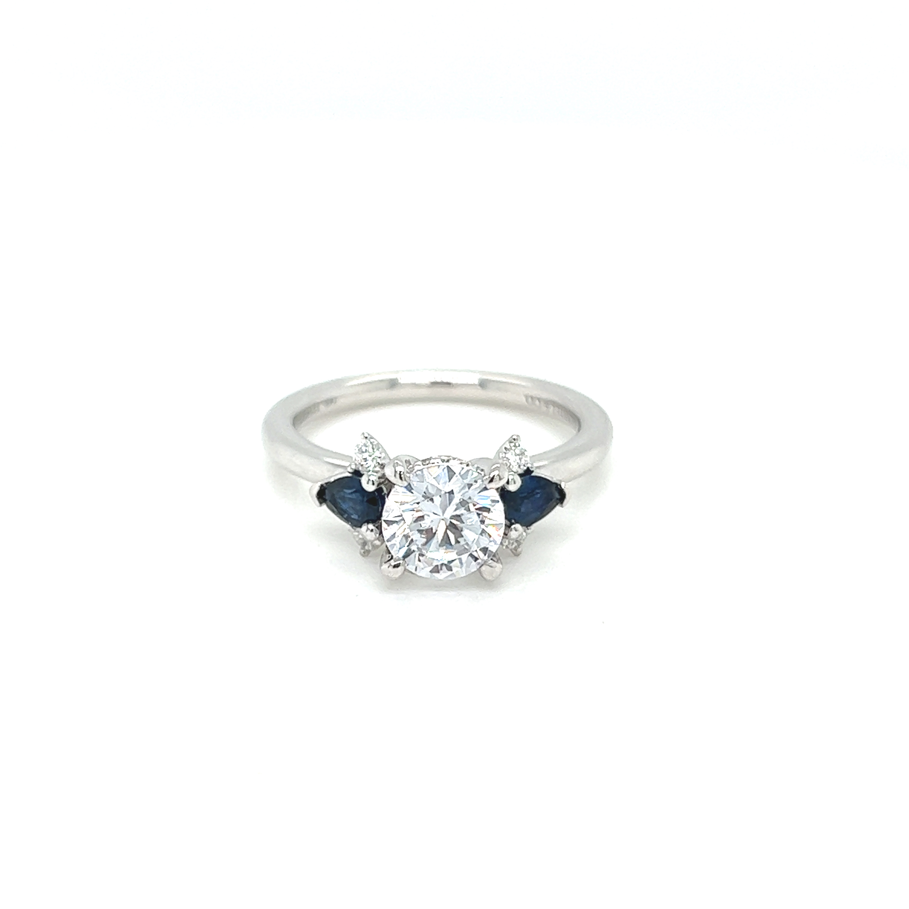 14 Karat white gold accented semi mount ring Size 6.5 with 2=0.34 total weight pear Sapphires and 10=0.11 total weight round brilliant G VS Diamonds