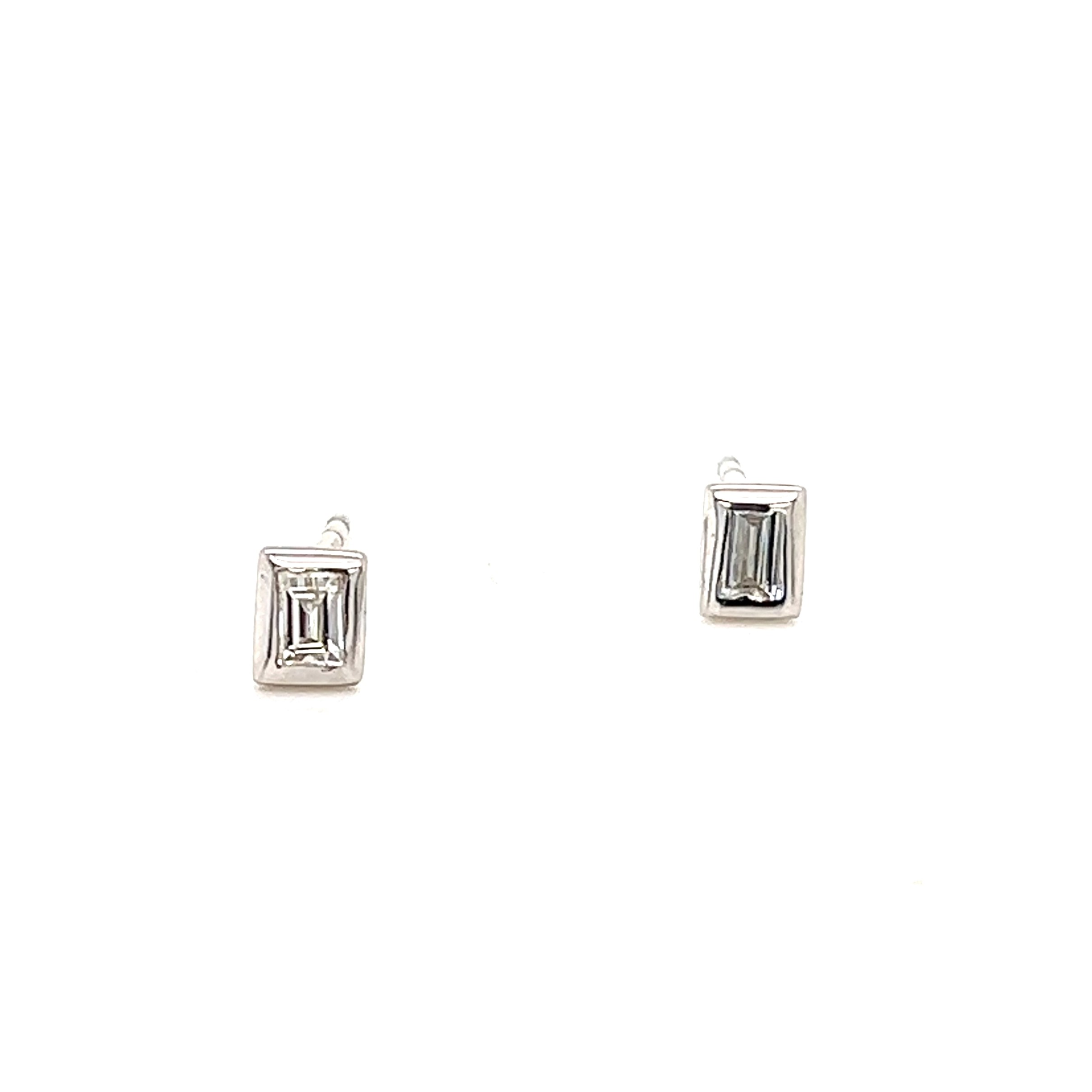 14 Karat white gold stud earrings With 2=0.20 total weight bezel set baguette Diamonds