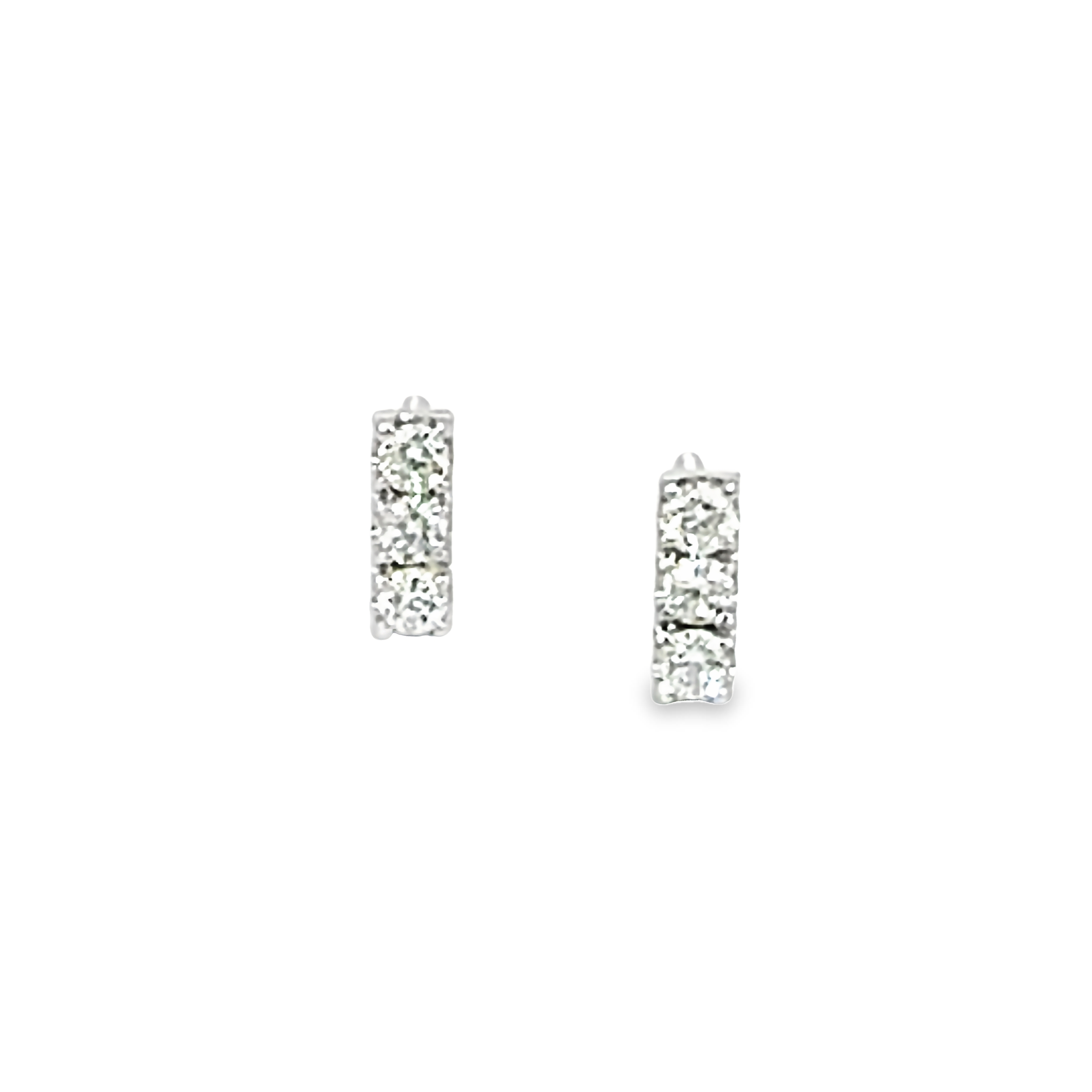 14 Karat white gold three stone stud earrings with 6=0.11 total weight round brilliant G I Diamonds