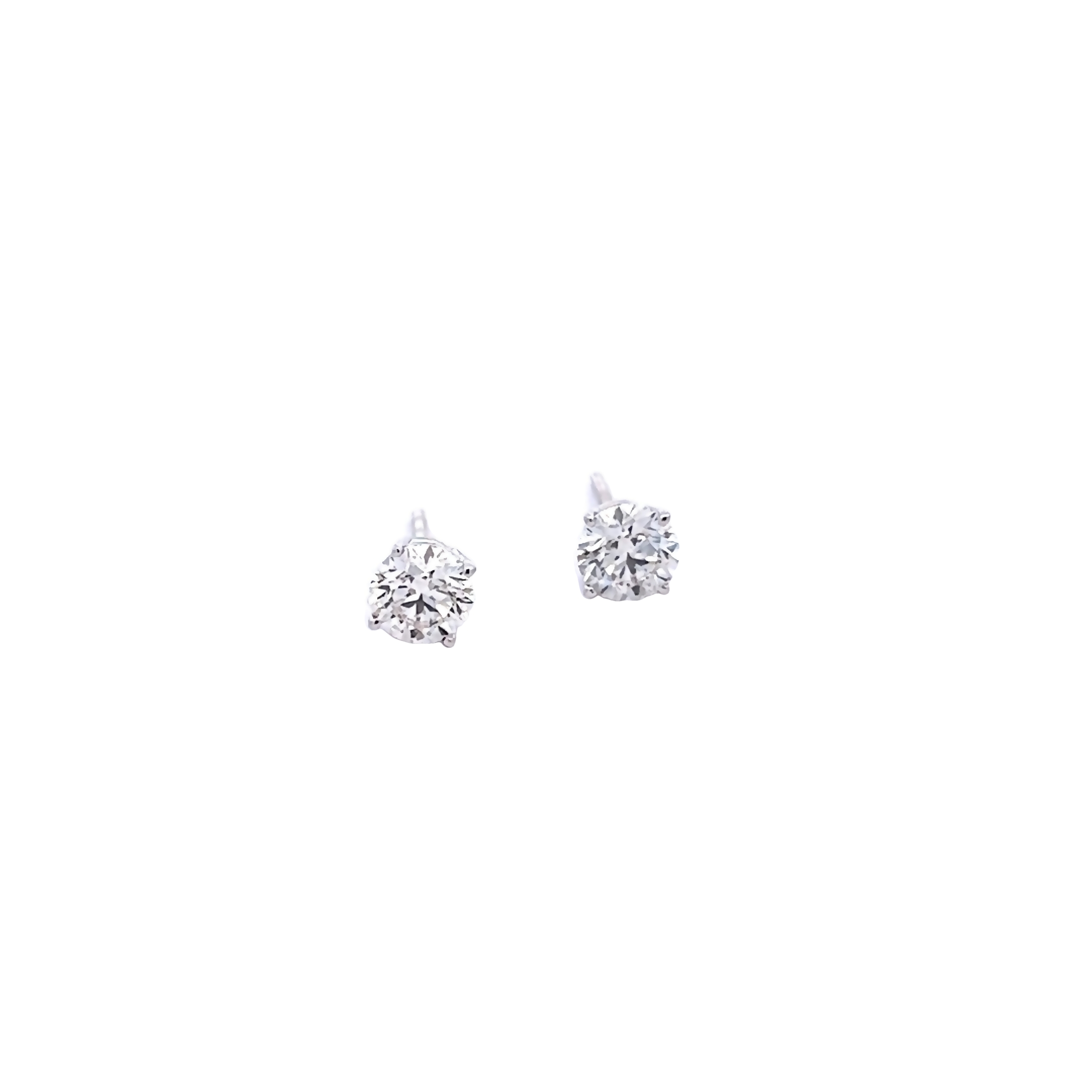 14 Karat white gold stud earrings with 2=1.00 total weight round brilliant M VS Diamonds