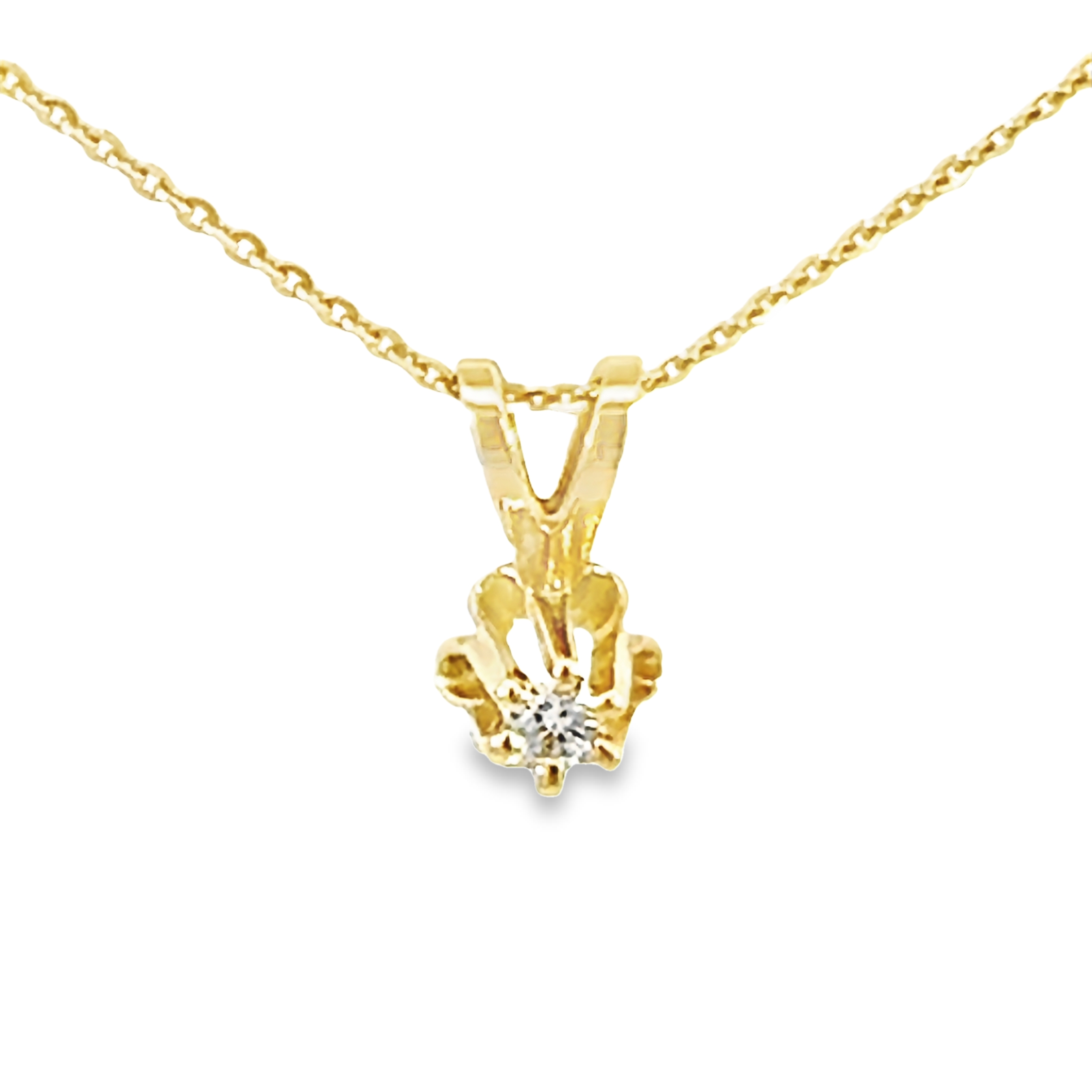 14 Karat yellow gold flower pendant with One 0.03Ct Round Brilliant G SI Diamond