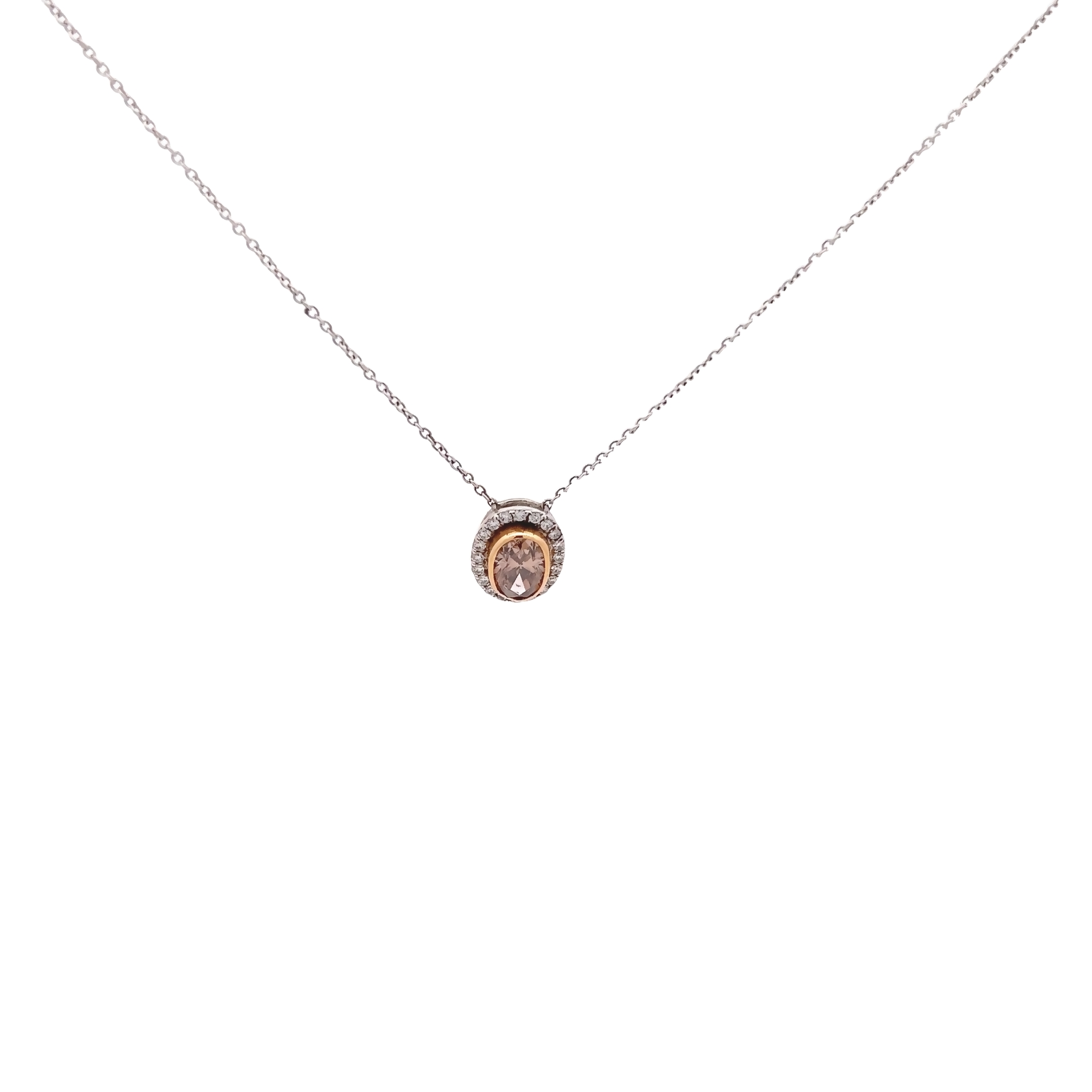 18 Karat white gold halo pendant with One 0.89Ct oval chocolate diamond set into 18 karat yellow gold and 21=0.13 total weight round brilliant G VS Diamonds