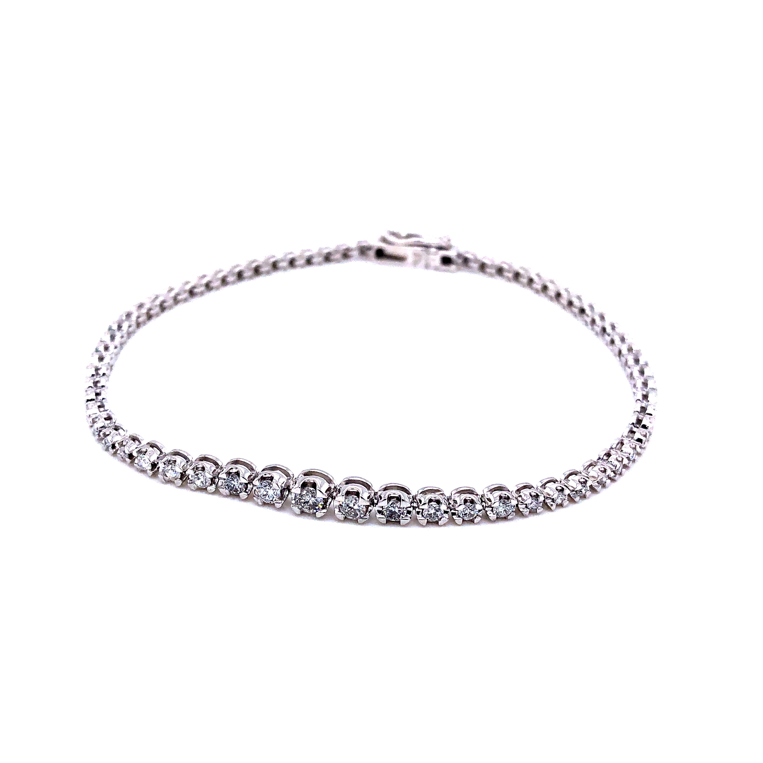 14 Karat tennis bracelet with 67=0.97 total weight round brilliant G SI Diamonds. Length 7.5"