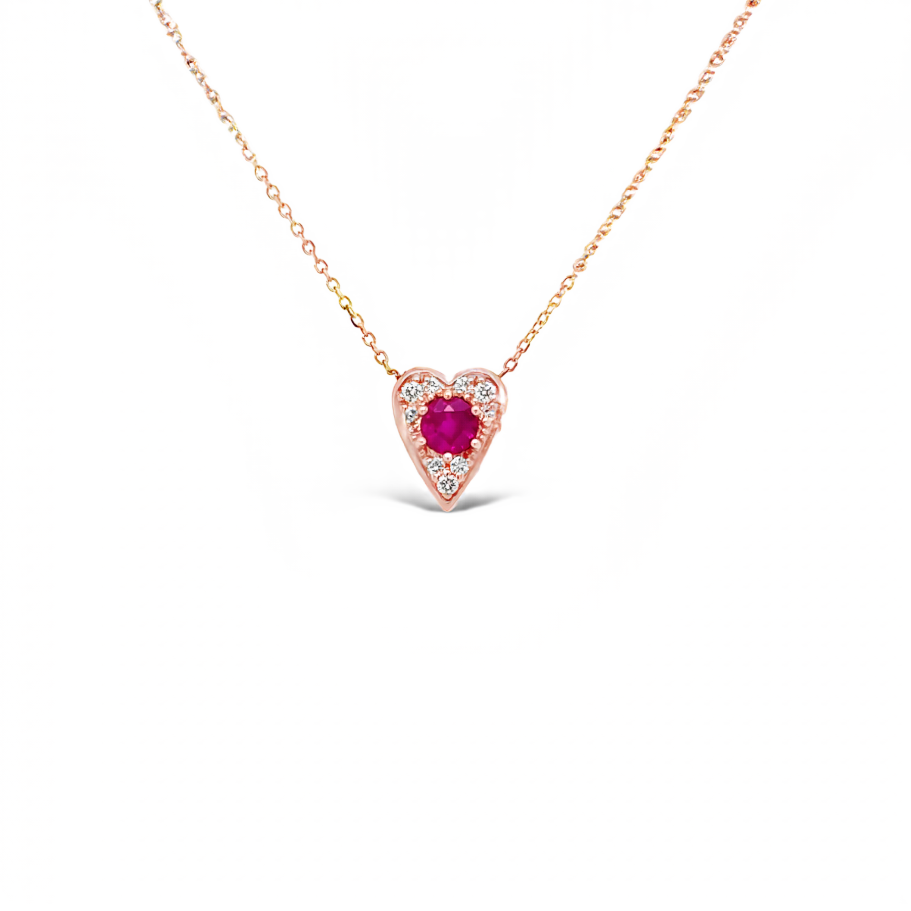 14 karat rose gold heart pendant with One 0.40Ct round Ruby and 9=0.09 total weight round brilliant G VS Diamonds