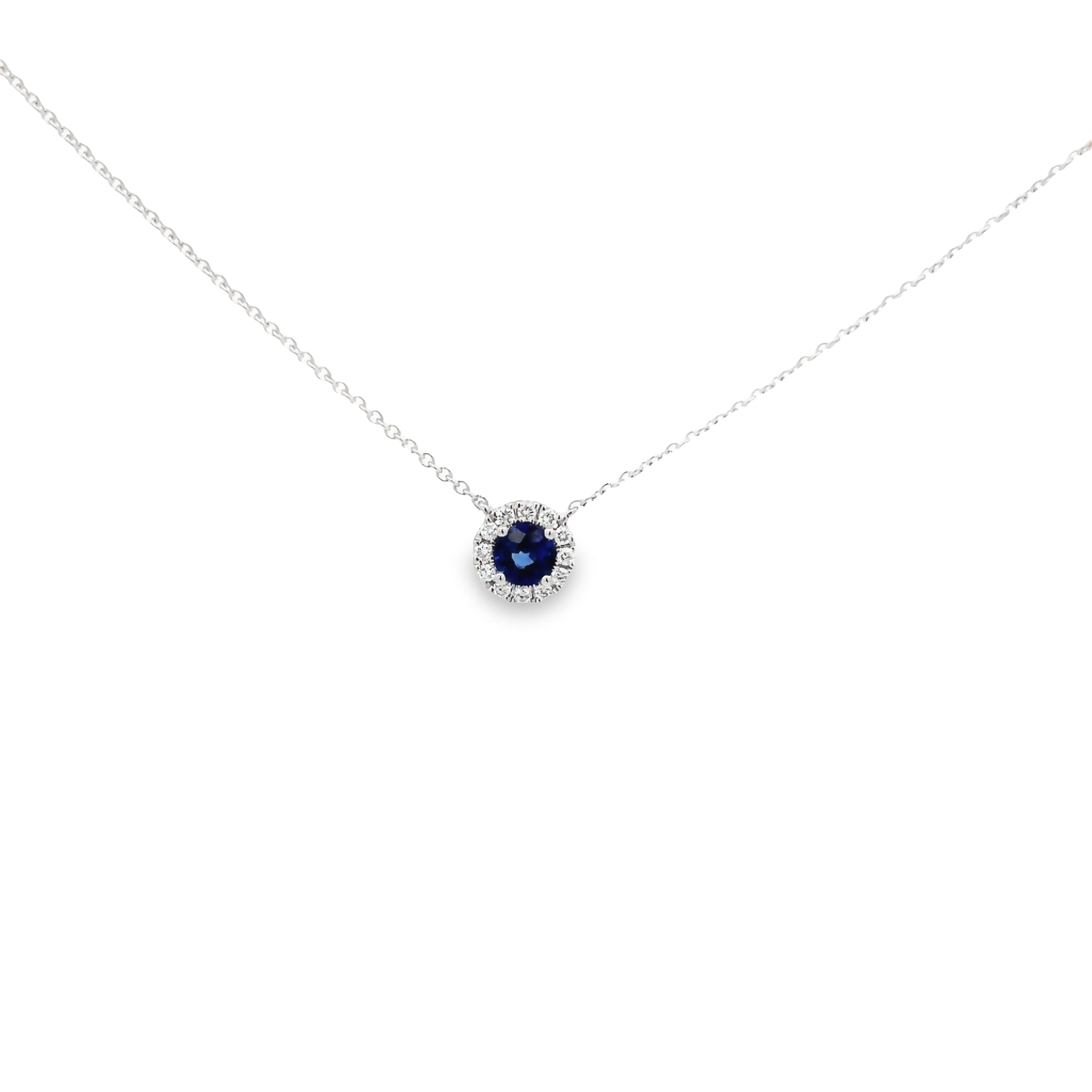 14 karat white gold halo pendant with one 0.43ct round mixed cut Sapphire and 12=0.15tw round brilliant G VS Diamonds