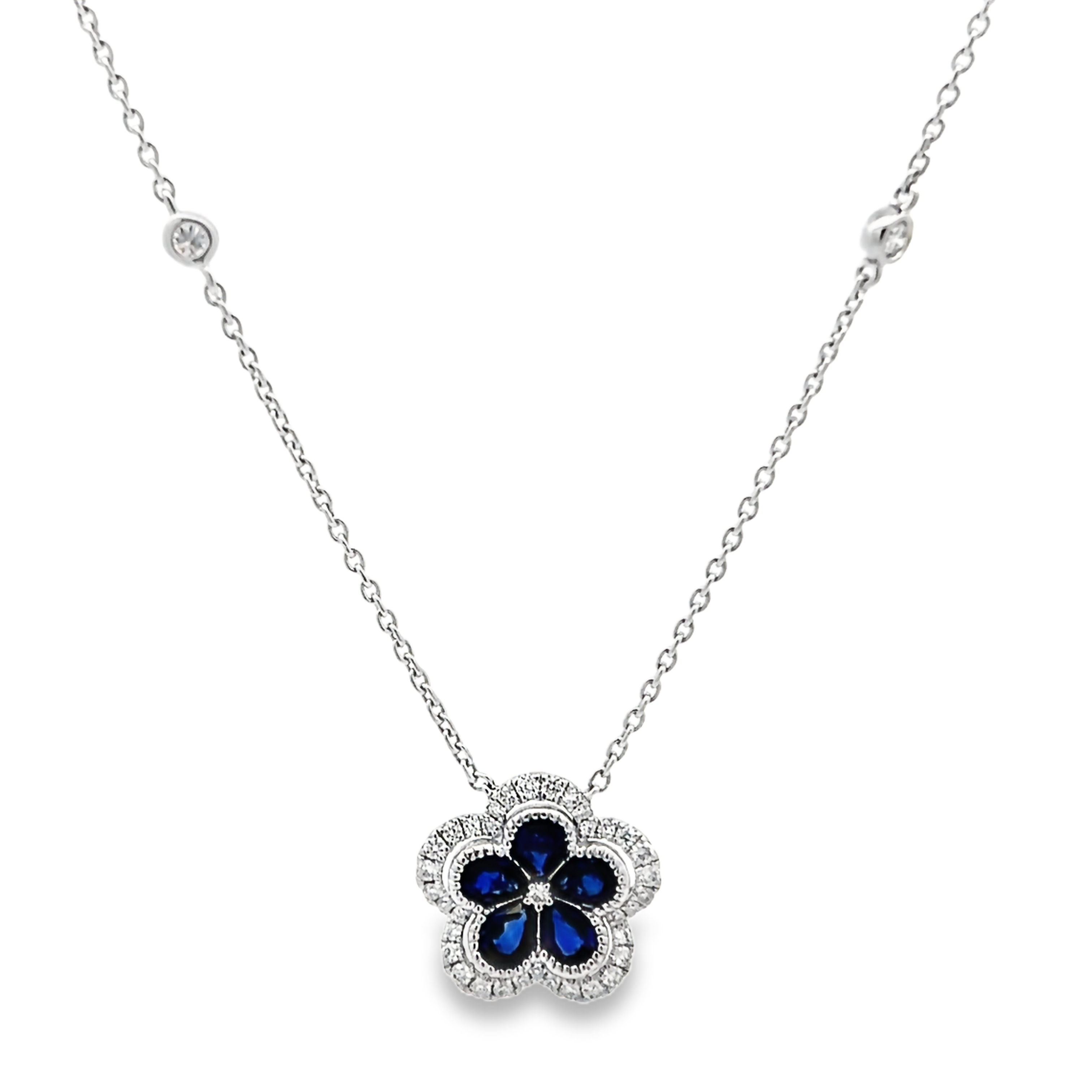 14 Karat white gold flower necklace with 5=0.90 total weight pear Sapphires and 40=0.29 total weight round brilliant G VS Diamonds