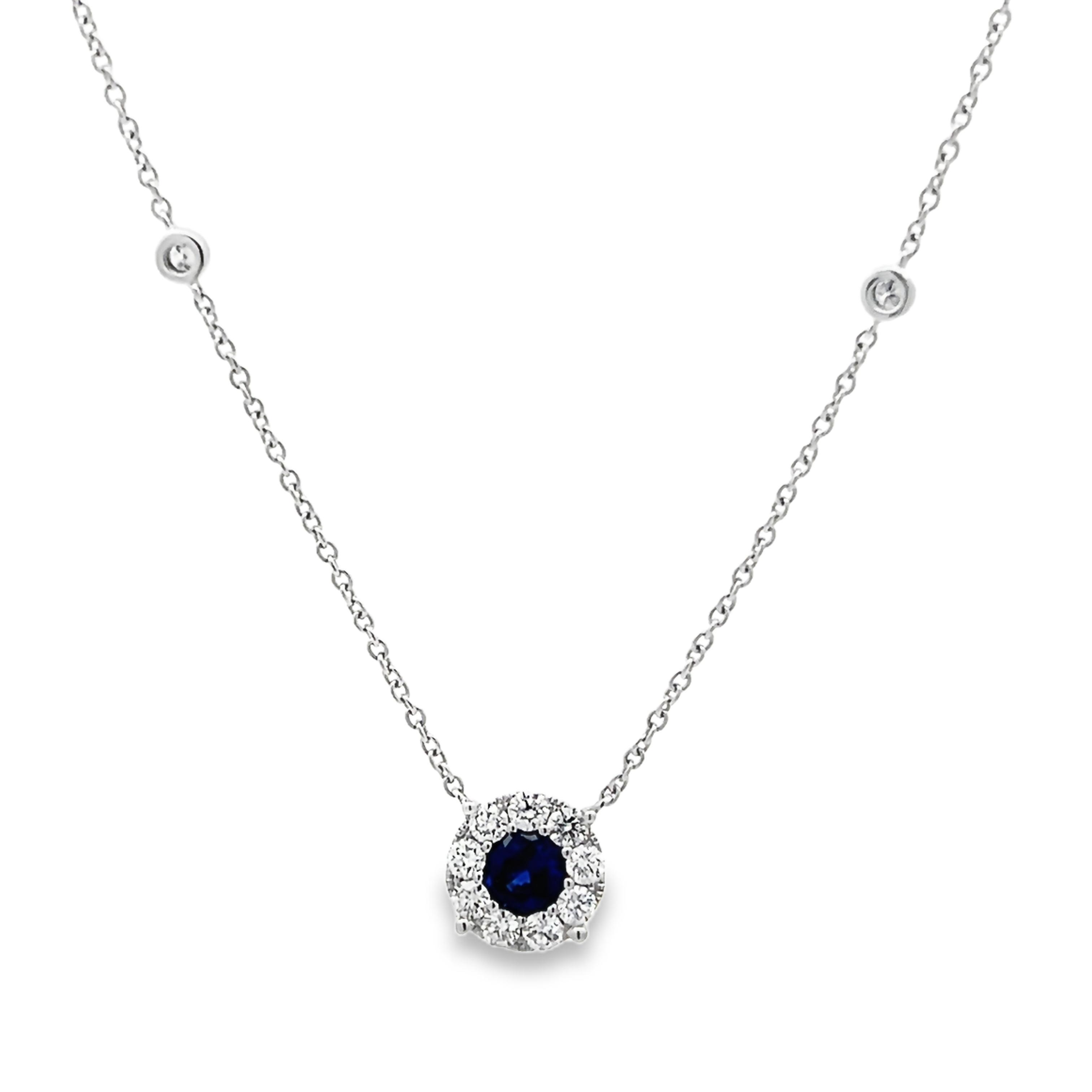 14 Karat white gold halo solitaire necklace with one 0.58 twt round mixed cut Sapphire and 13=0.44 total weight round brilliant G VS Diamonds