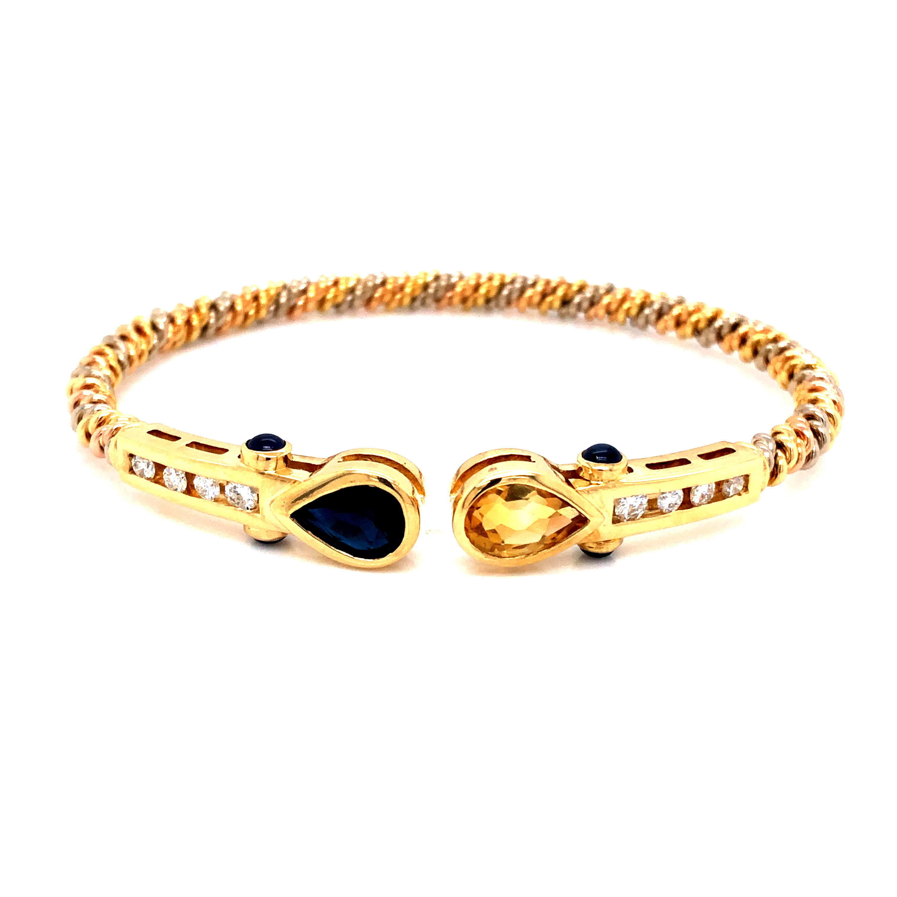18 Karat Bracelet With One 10.00X6.00Mm Pear Sapphire  One 10.00X6.00Mm Pear Citrine  8=.33 G SI Diamonds and 4 2.0 mm Round Blue Sapphires on the sides.