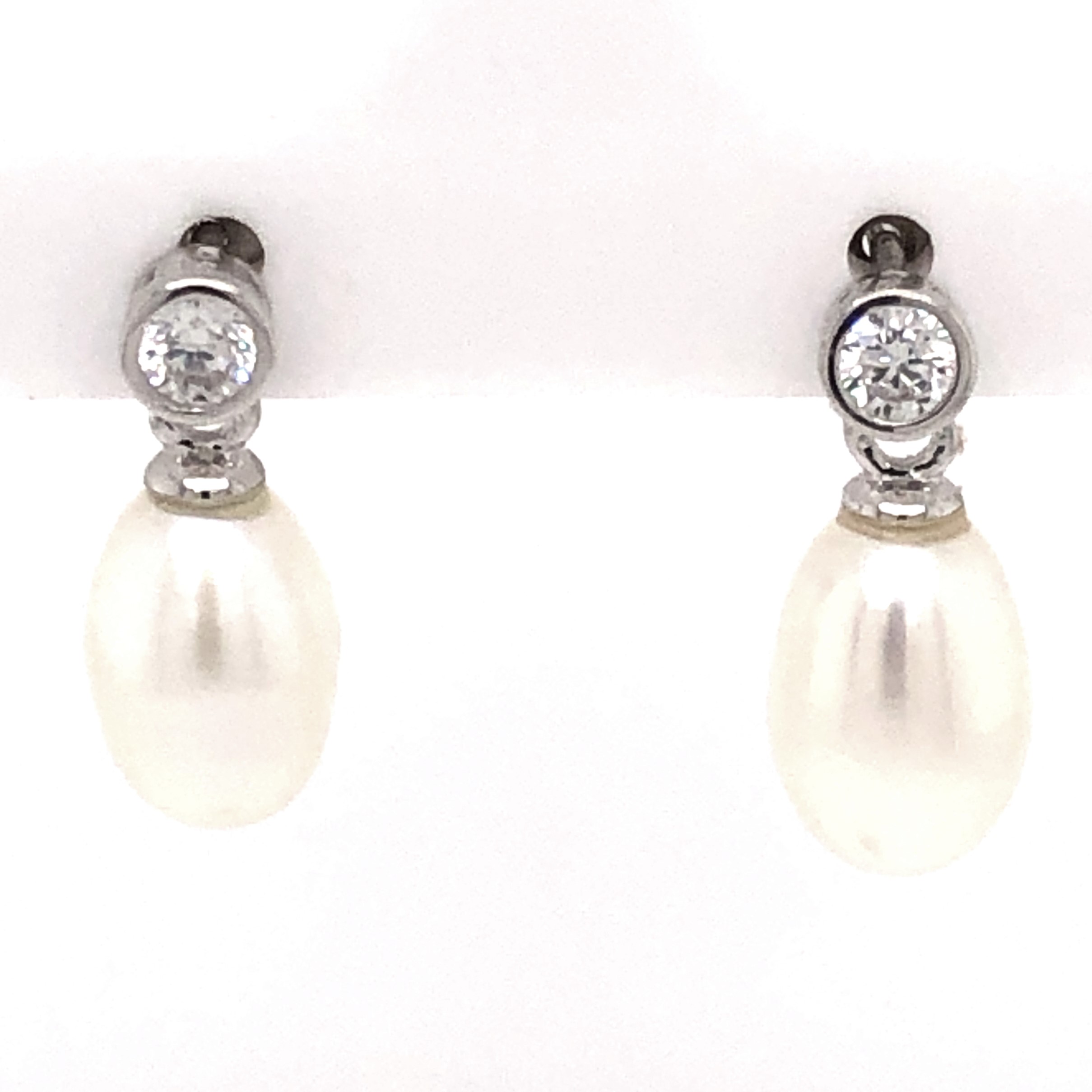 SS Earrings With 2 Freshwater pearls set below two CZ