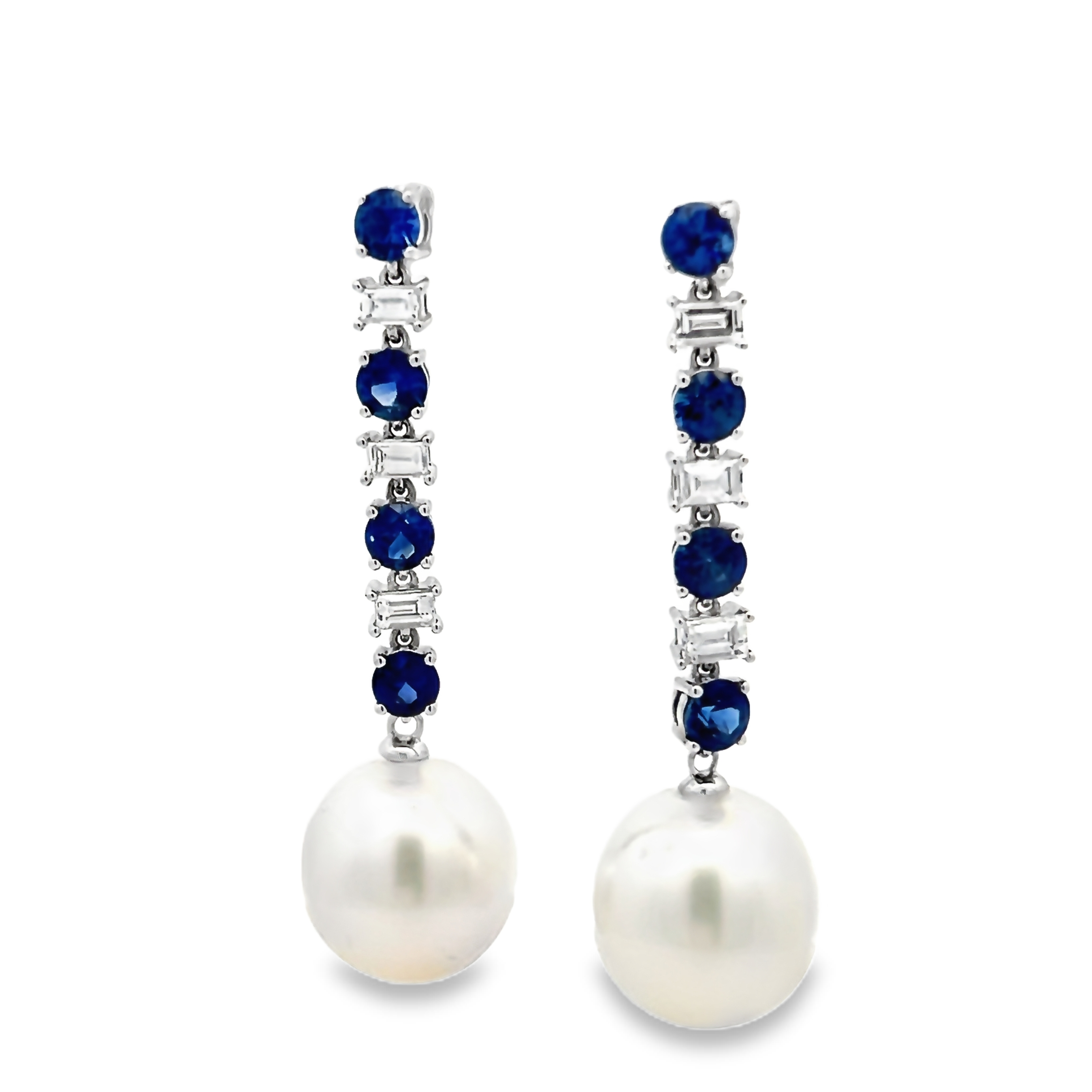 18 Karat White Gold Dangle Earrings With 2=12.00-13.00mm South Sea Pearls, 6=0.54 Total Weight Baguette G Vs Diamonds And 8=1.95 Total Weight Round Mixed Cut Sapphires