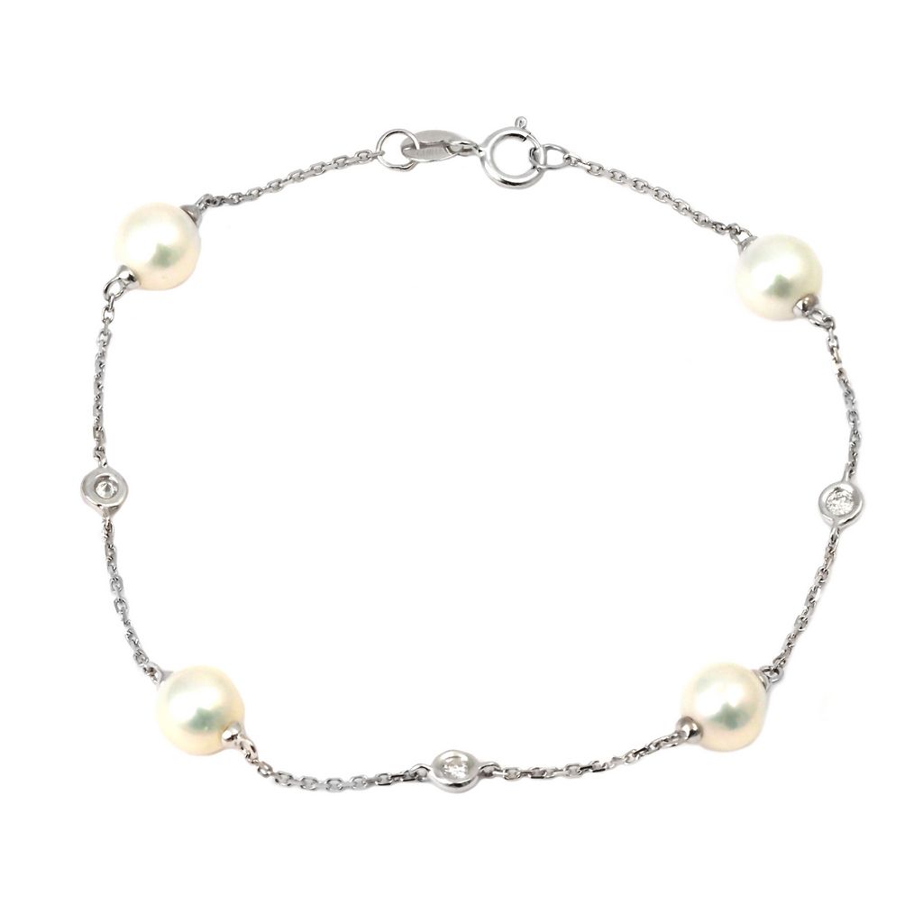 14 Karat white gold bracelet with 3=0.08 total weight round brilliant G I Diamonds and 4=6.00mm Cultured Pearls