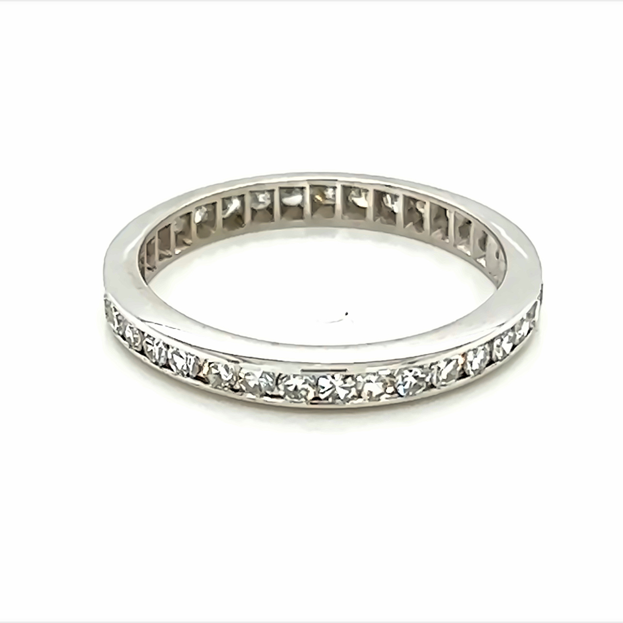 Platinum Channel Set Eternity Ring Size 6.5 Set Completly around with Round Brilliant G SI Diamonds.