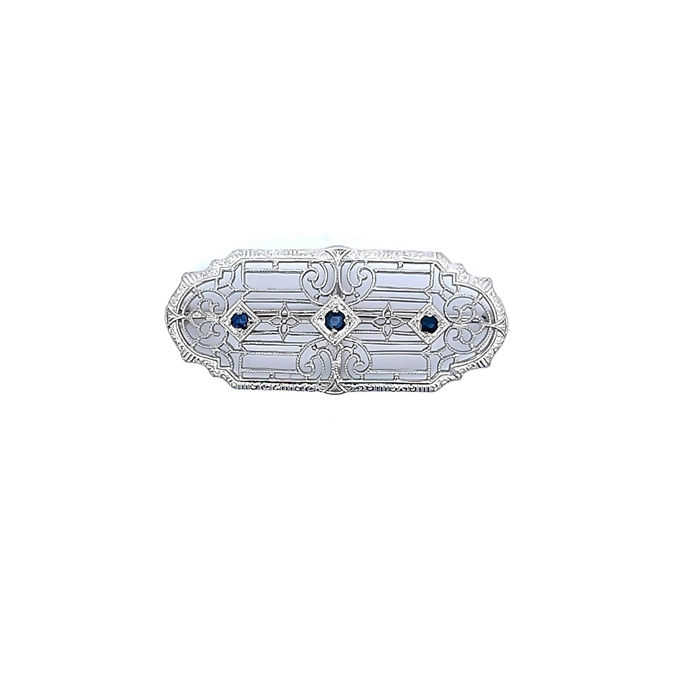 White 14 Karat Filigree Pin with three 2.0 MM round blue sapphires.