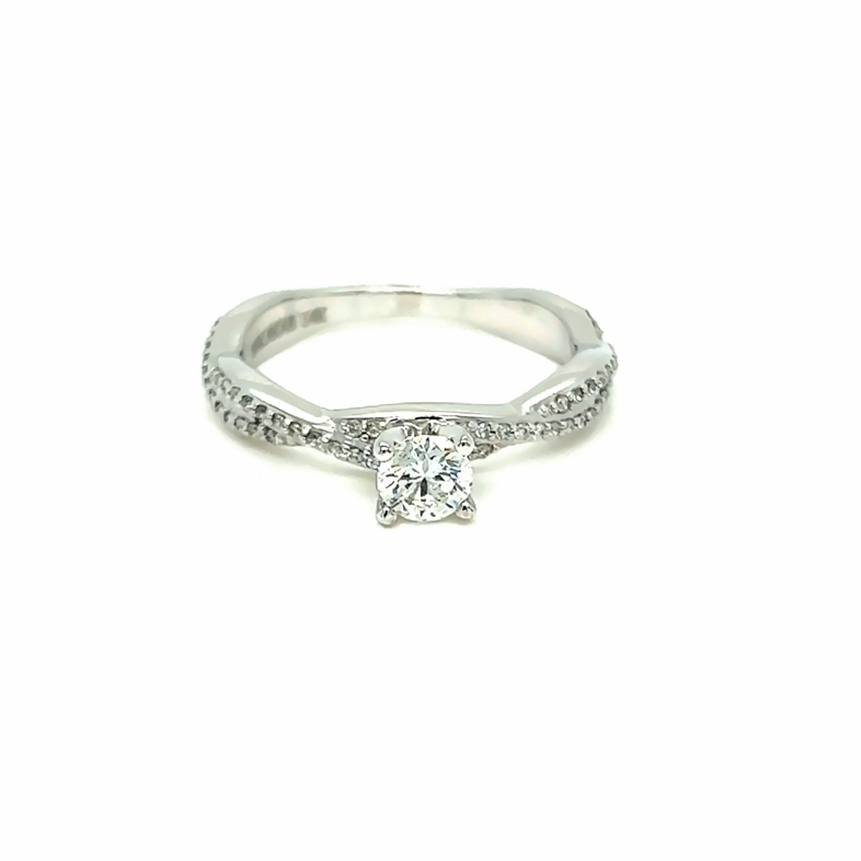 14 Karat white gold engagement ring with One 0.35Ct Round Brilliant G I2 Diamond and 56=0.15Tw round brilliant G Vs Diamonds