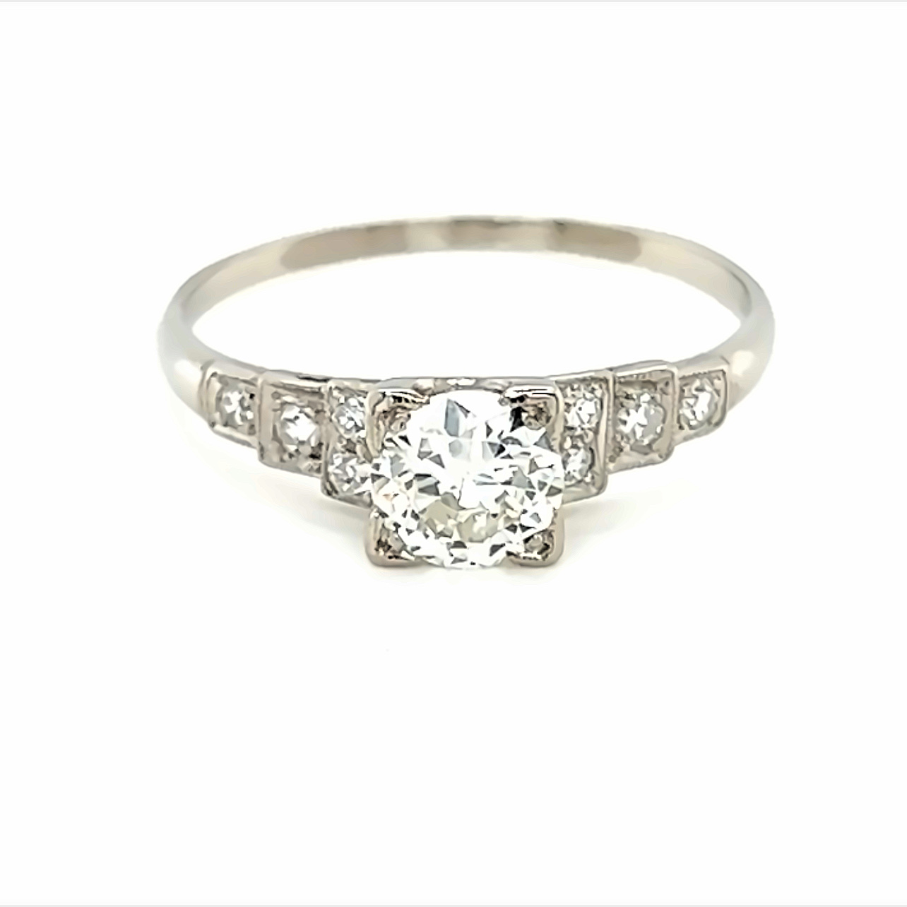 Lady s Platinum Engagement Ring with one 0.70ct Round Brilliant K VS1 Diamond and  8=0.25tw Single Cut G VS Diamonds