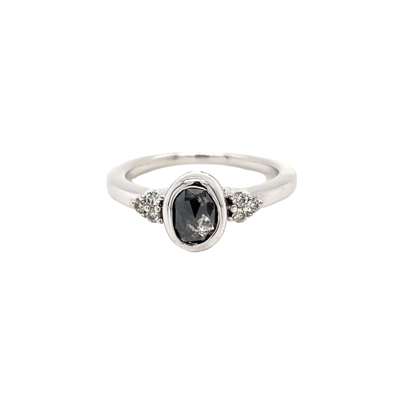 14k White gold ring with one 1.13 ct Salt and Pepper oval bezel set Diamond and 6=.12ct