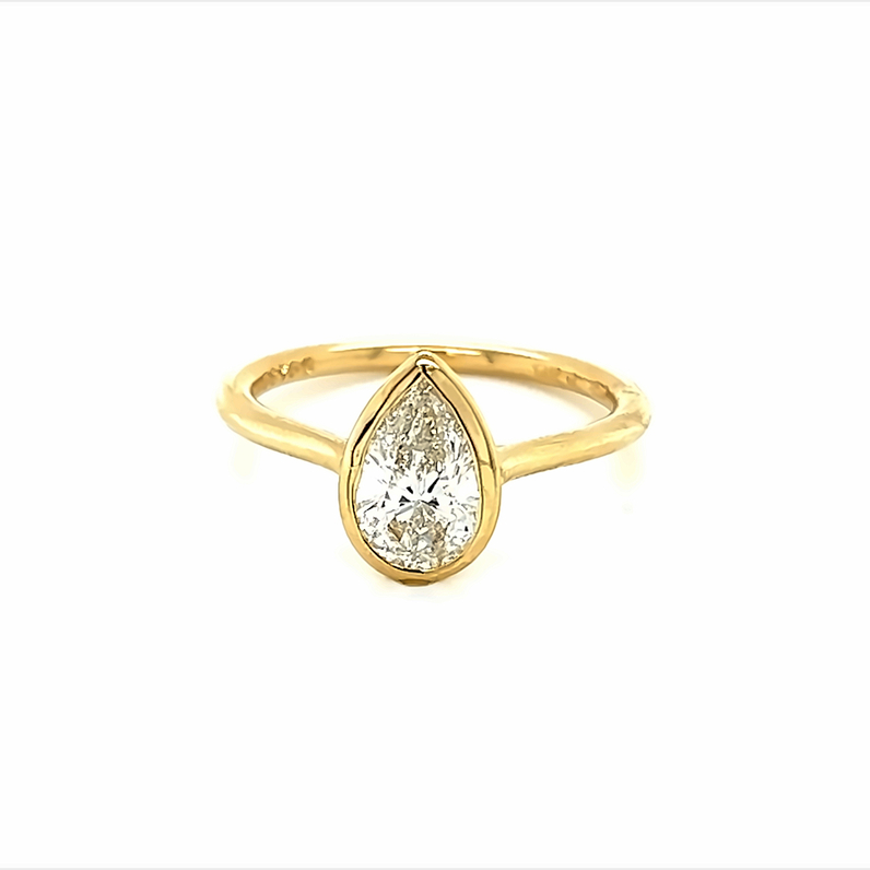 Yellow 14 Karat Engagement Ring with one bezel set 1.01ct Pear G SI2
