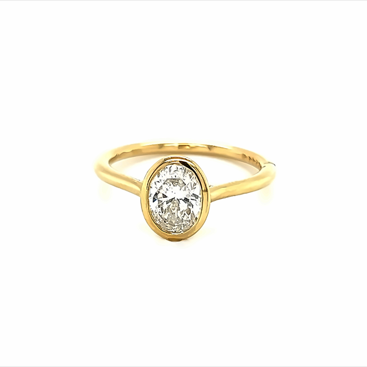 14 Karat Yellow Gold Engagement Ring Size 6.5 with one bezel set 1.00ct Oval F SI1 Diamond
