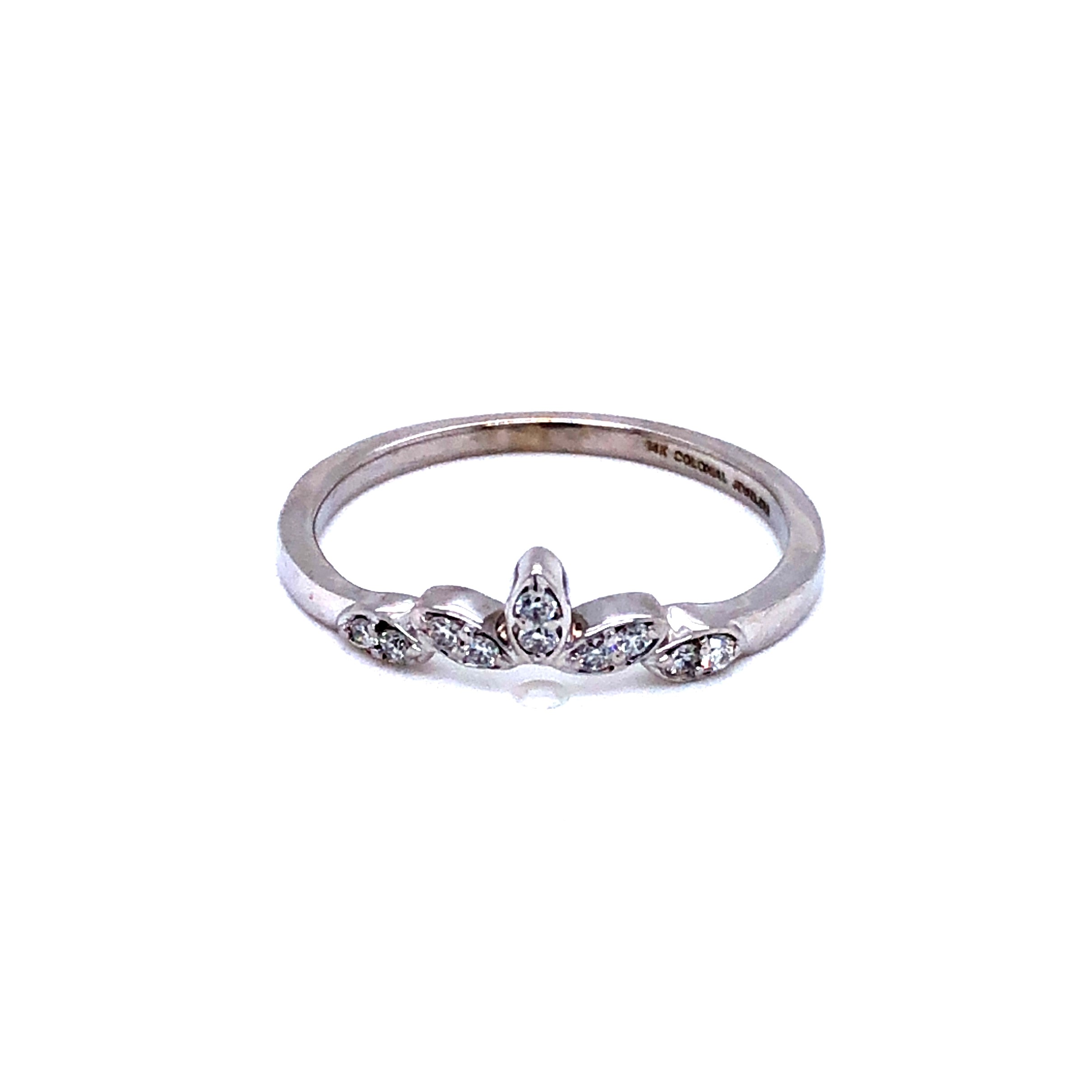 14 Karat white gold curved wedding band with 10=0.10 total weight round brilliant G VS Diamonds. Size 7