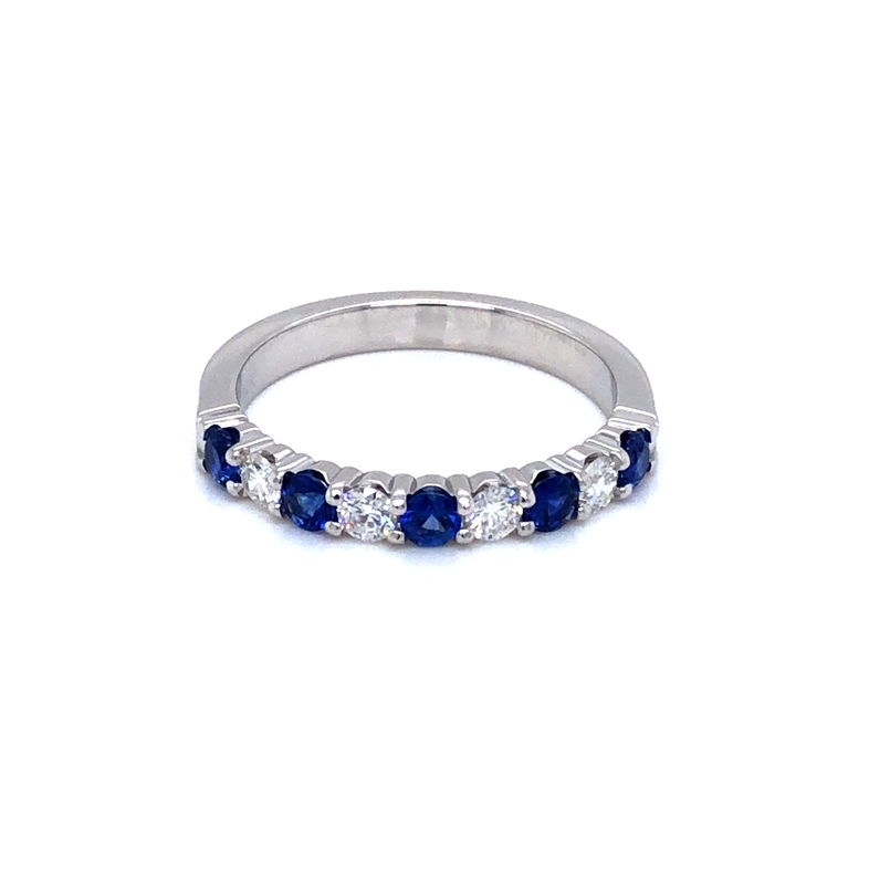 14 karat color wedding band with 4=0.27 total weight round brilliant G VS Diamonds and 5=0.40 total weight round mixed cut Sapphires. Size 6.5