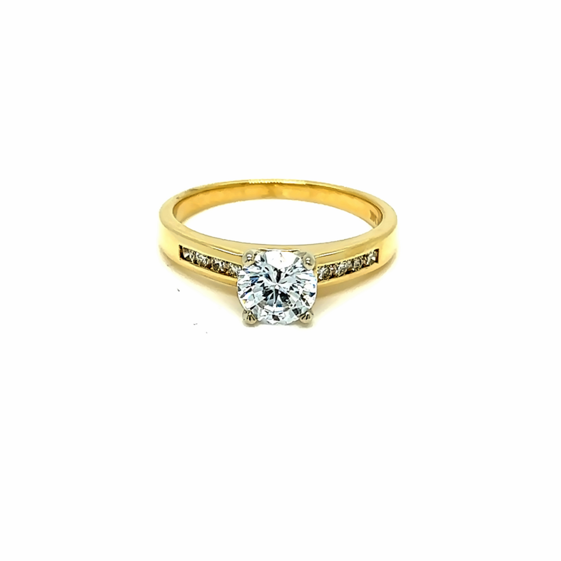 Yellow 14 Karat Channel Ring with 8=0.14tw Round Brilliant G VS Diamonds and   one RB Cubic Zirconium