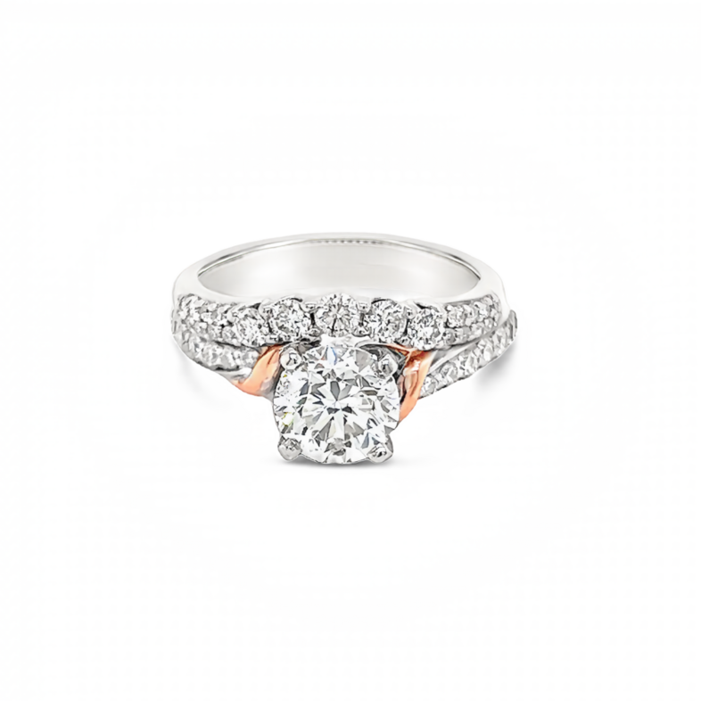 14 Karat white gold wedding set with rose gold trim with One 1.40ct Round Brilliant J I1 Diamond And  39=1.00tw Round Brilliant G SI Diamonds