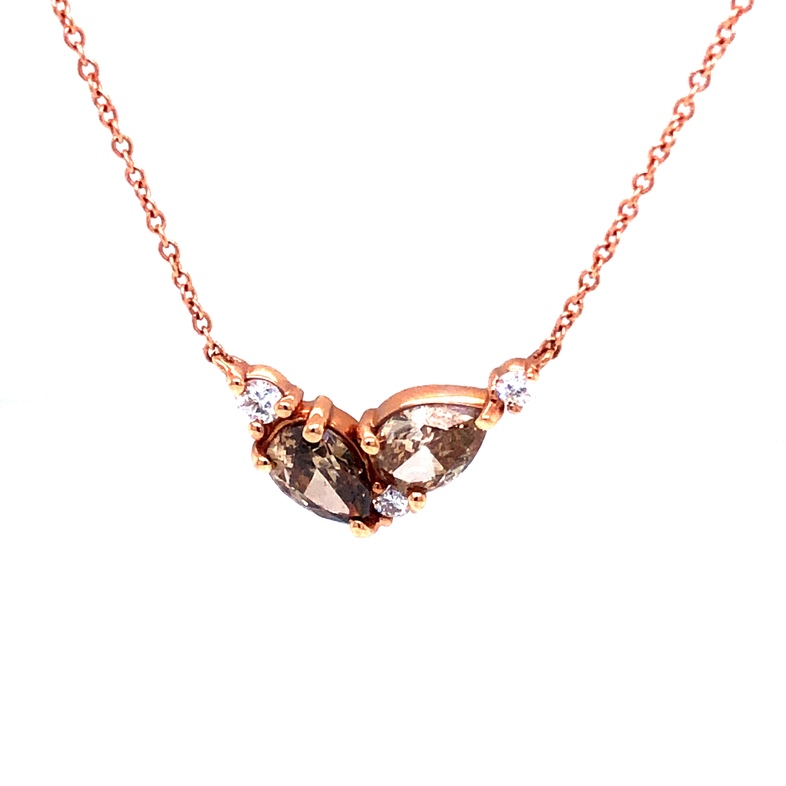 14 Karat rose gold necklace with One Pear Natural Fancy Chocolate Diamond and 3=1.10twt Round Brilliant G SI Diamonds