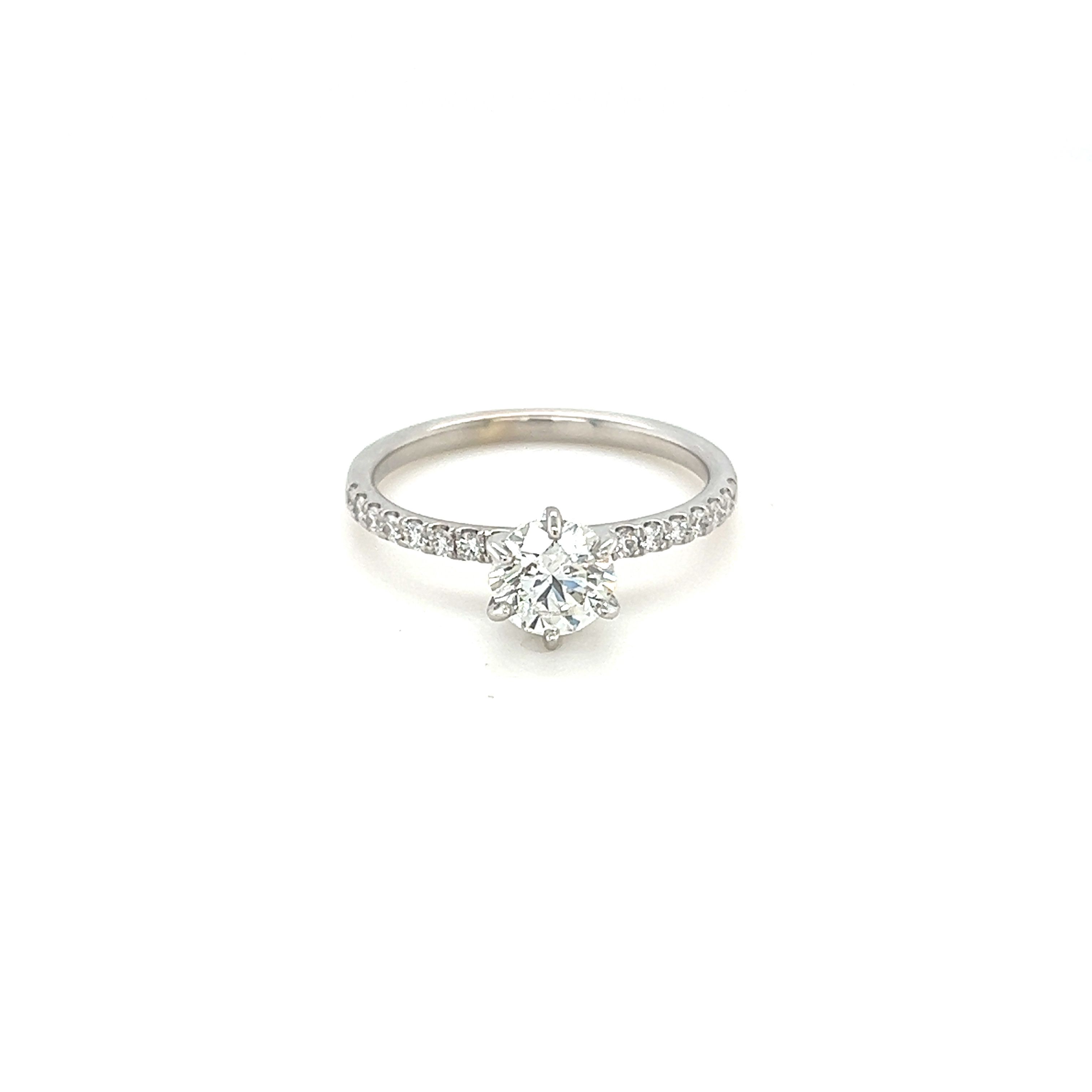 14 Karat white gold engagement ring with one 0.71ct Round Brilliant I SI1 Diamond  GIA 536619456 &  16=0.18tw Round Brilliant G SI Diamonds
