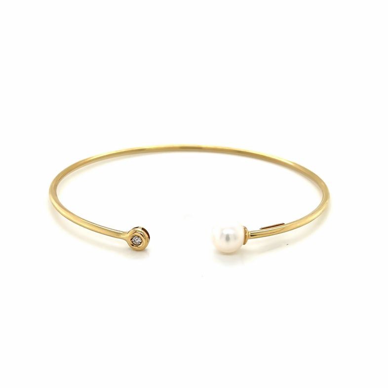 Yellow 14 Karat Bangle Bracelet With One 0.03Ct Round G VS Diamond And One Fresh Water Pearl