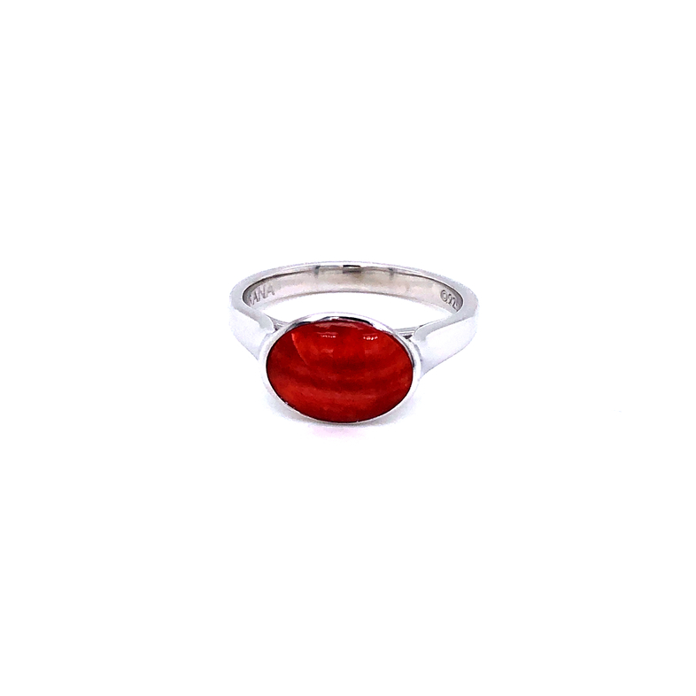 Lady s sterling ring set with one red oyster shell.