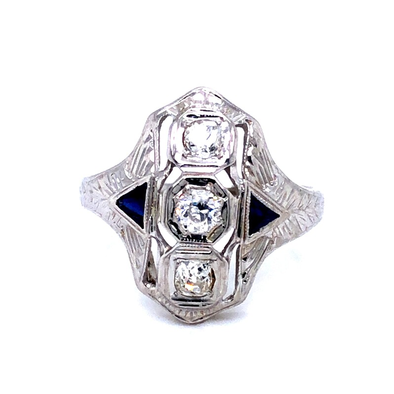 White 18 Karat Estate Ring with 3=.50 G SI diamonds and Two Triangle shaped Blue Sapphires.
