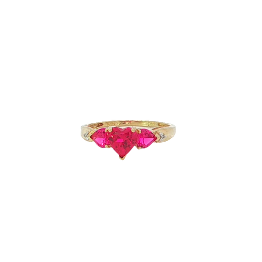 Elegant Yellow Gold Ring Featuring Heart Shaped Red Gemstones