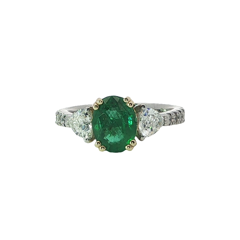 Elegant Diamond And Oval Cut Emerald Ring
