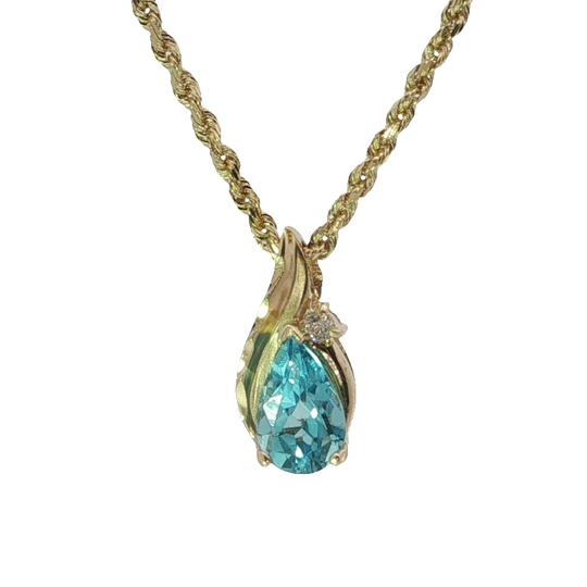 Elegant Pear-shaped Blue Topaz Pendant Necklace In Yellow Gold