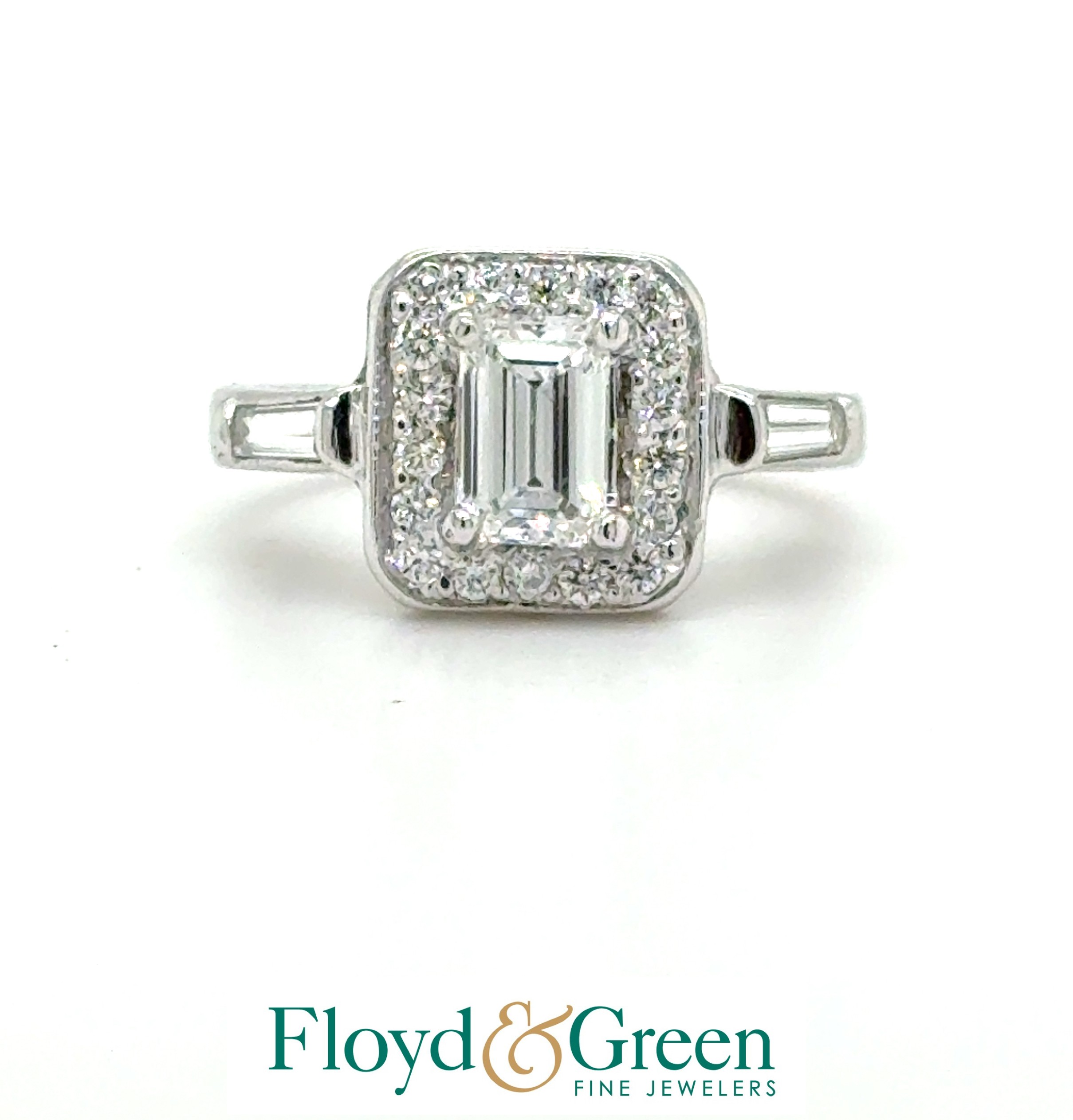 White 14 Karat Engagement Ring Size 4 2 = 0.40TWT Baguette G VS2 Diamonds
16 = 0.30TWT Round F/G SI1 Diamonds
one = 0.58CT Emerald F SI1 Diamond