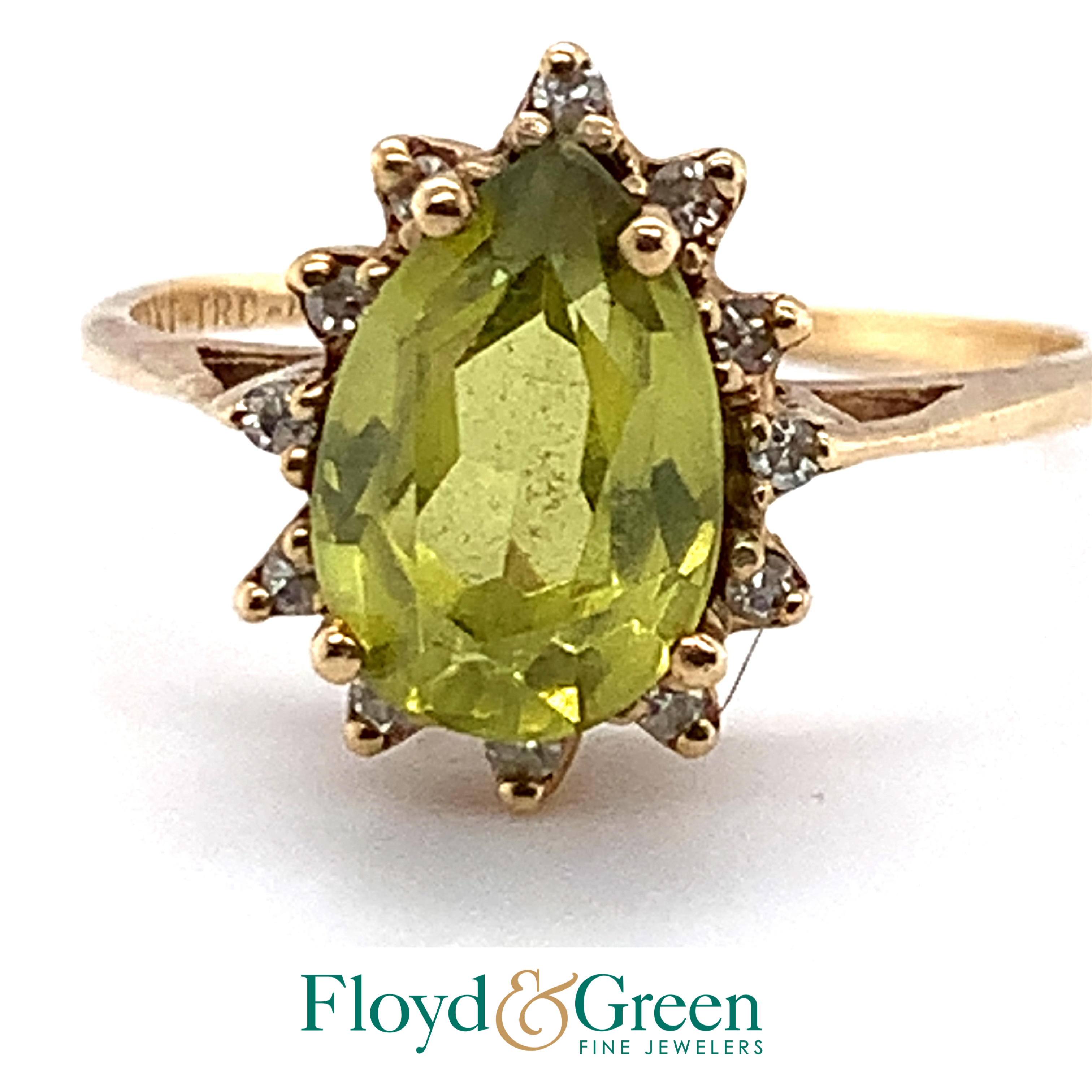 yellow ring with pear shaped light green stone and clear stones, 2.9g