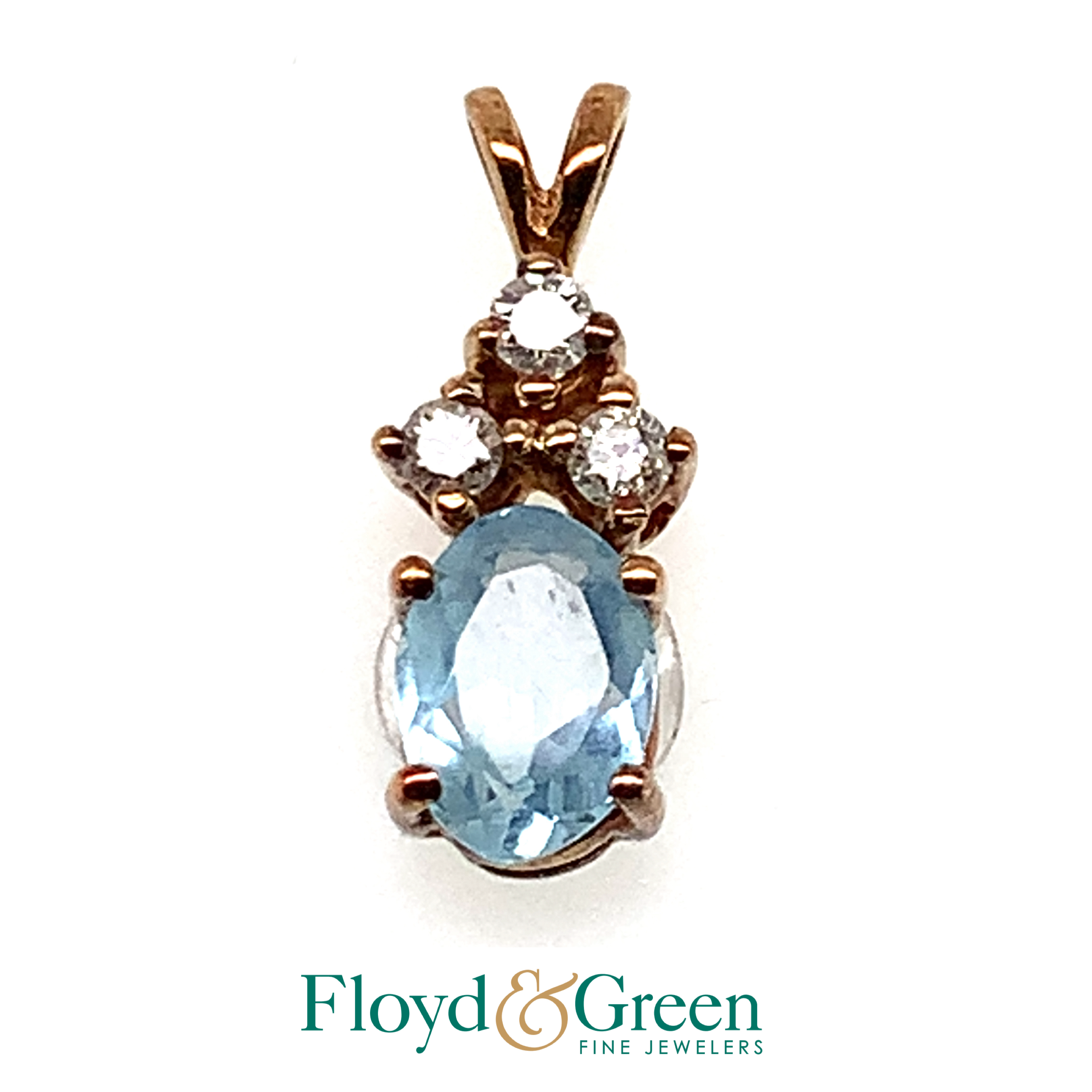 oval light blue stone with 3 clear stones