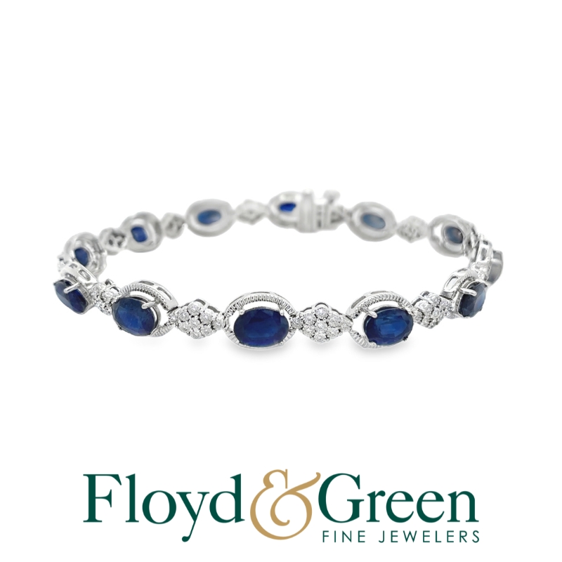 Link 14KW Bracelet 7.25 inch
12 Oval Blue 12.35ct Sapphires 
108 Round 0.33ct Diamonds I VS2-SI1