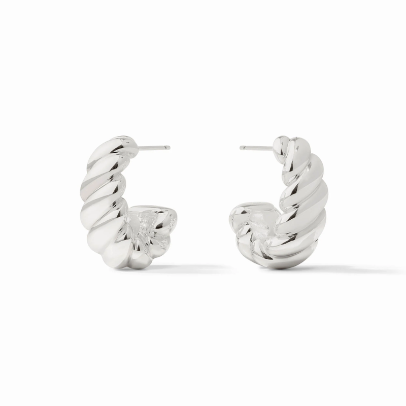 The Julie Vos Ravello Statement Hoop Earrings in silver bring bold, polished elegance to any look. Crafted in pure silver plate and sealed to preserve its luminous finish, these small-sized hoops feature a sculptural silhouette with softly rounded curves 