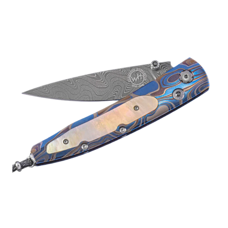 B10 SUNDOWN A light and resilient laser engraved titanium frame with gold lip mother of pearl and 'Boomerang' damascus Limited Edition 21/50