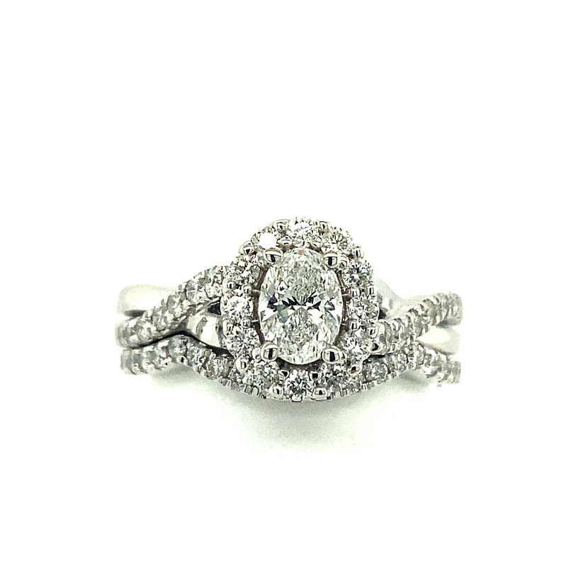 14K WHITE GOLD HALO WEDDING SET SIZE 7 WITH ONE 0.50CT OVAL H-I SI2 DIAMOND AND 61=0.75TW ROUND H-I I1 DIAMONDS  (6.13 GRAMS)